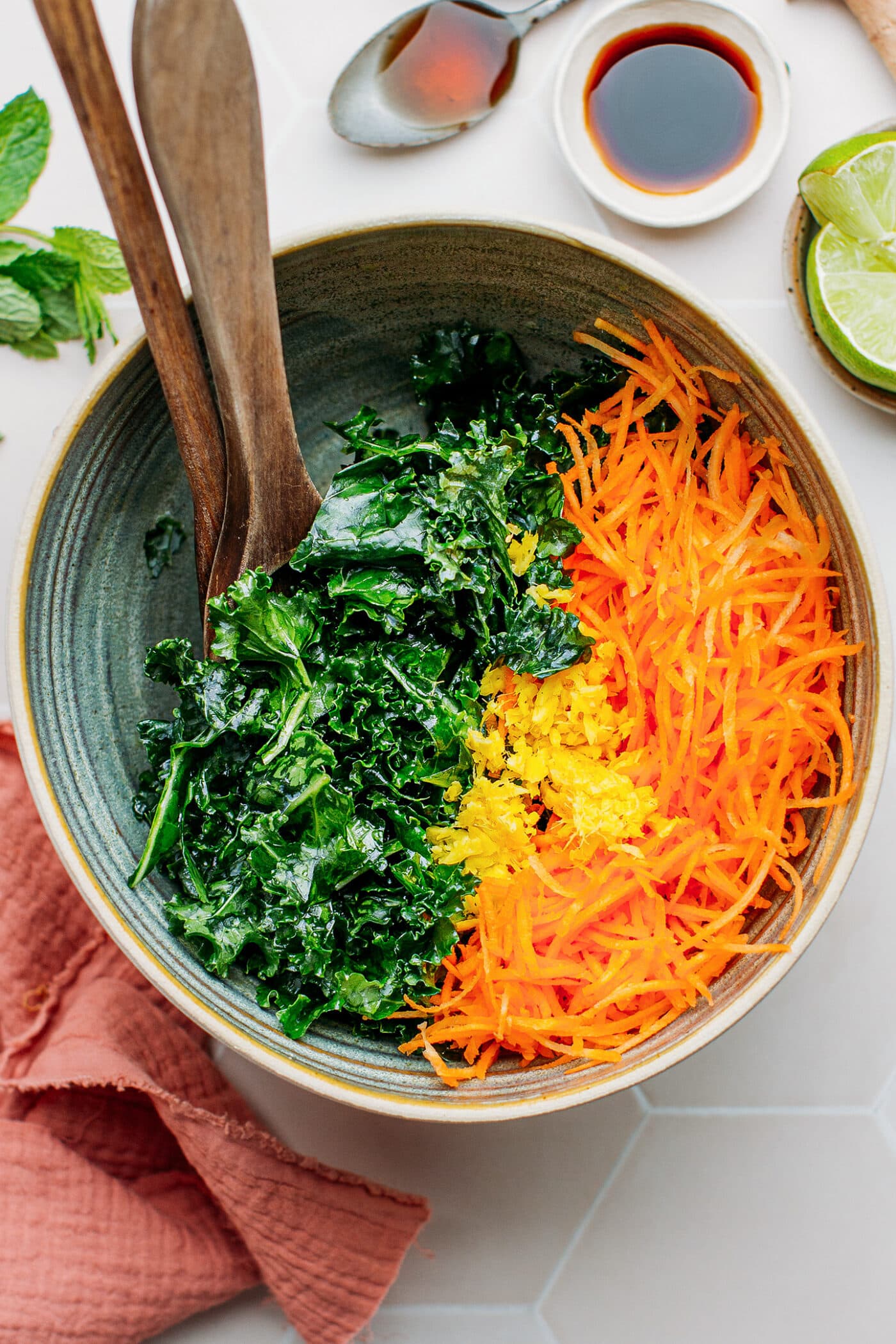 Kale, carrots, and ginger in a bowl.