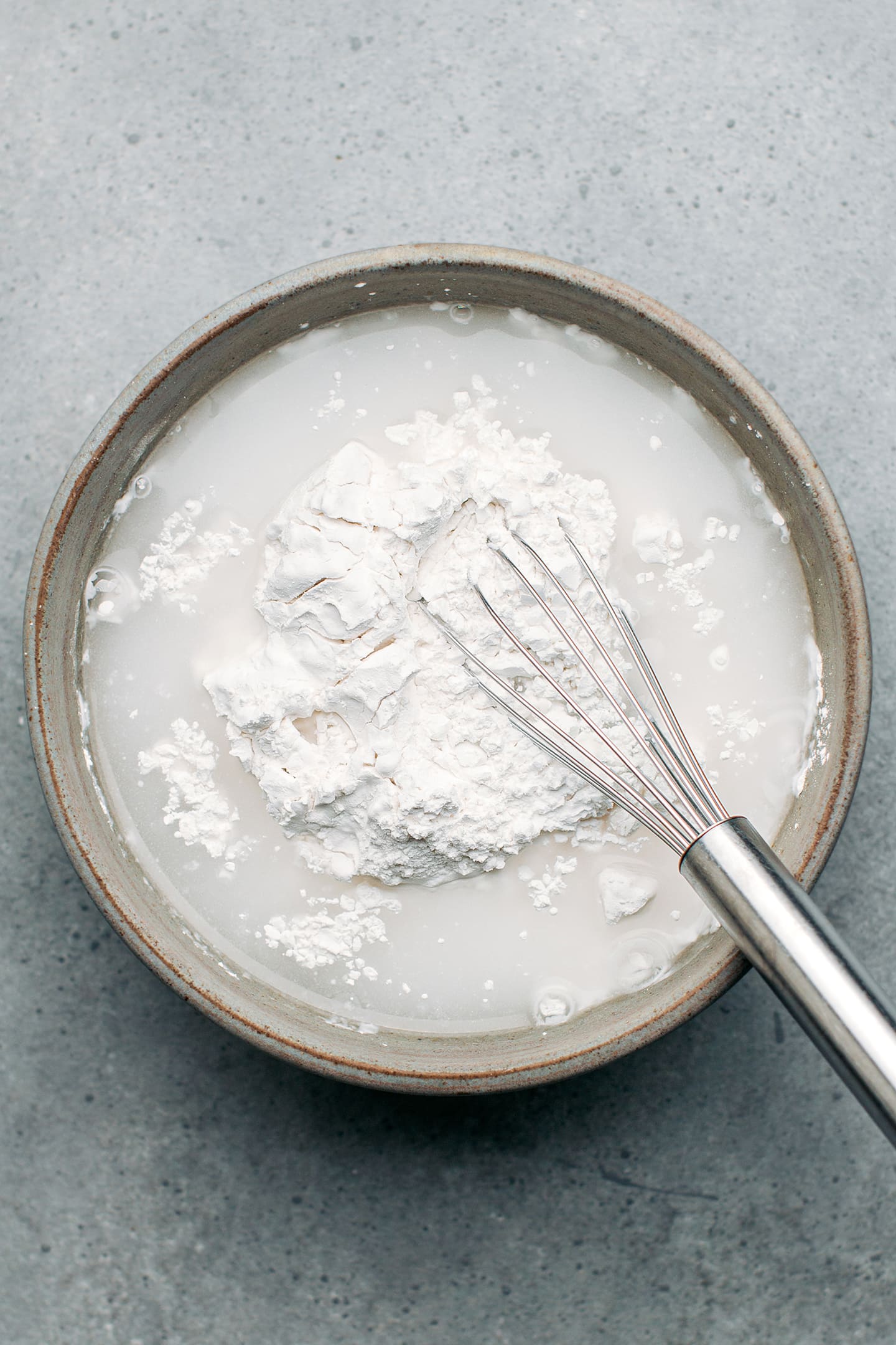 Rice flour and water in a mixing bowl.