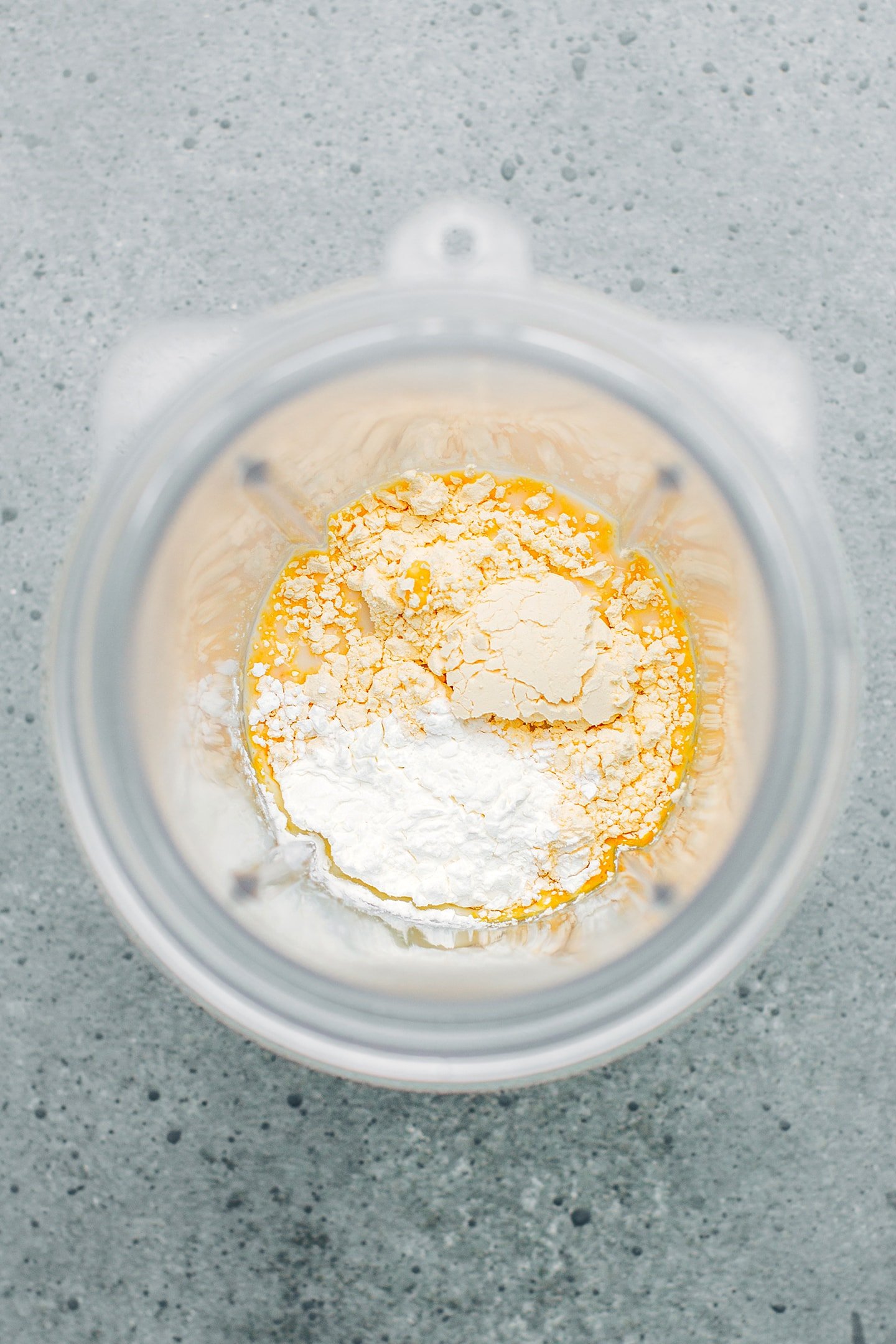 Almond milk and chickpea flour in a blender.