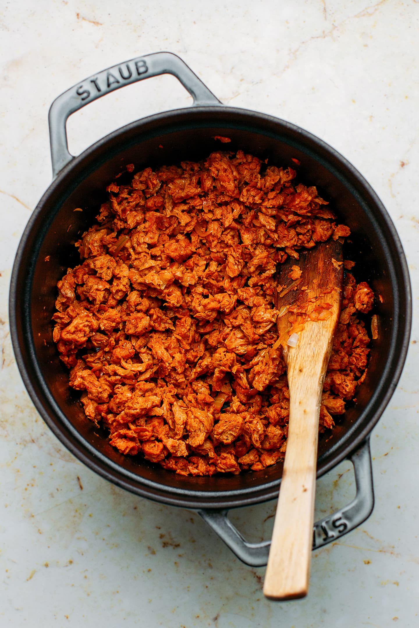 Sautéed soy curls in a pot.