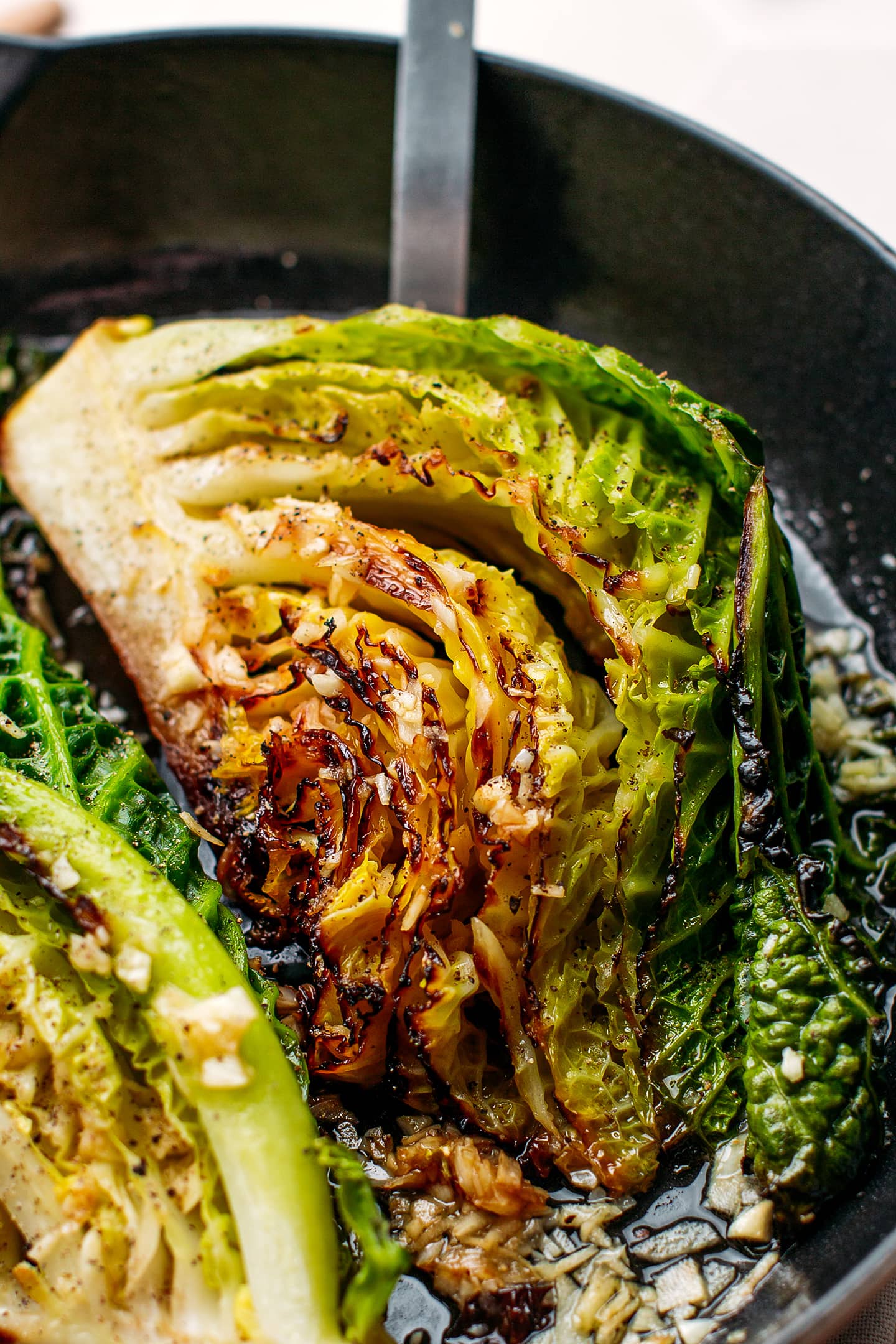 Close-up of braised cabbage with garlic.