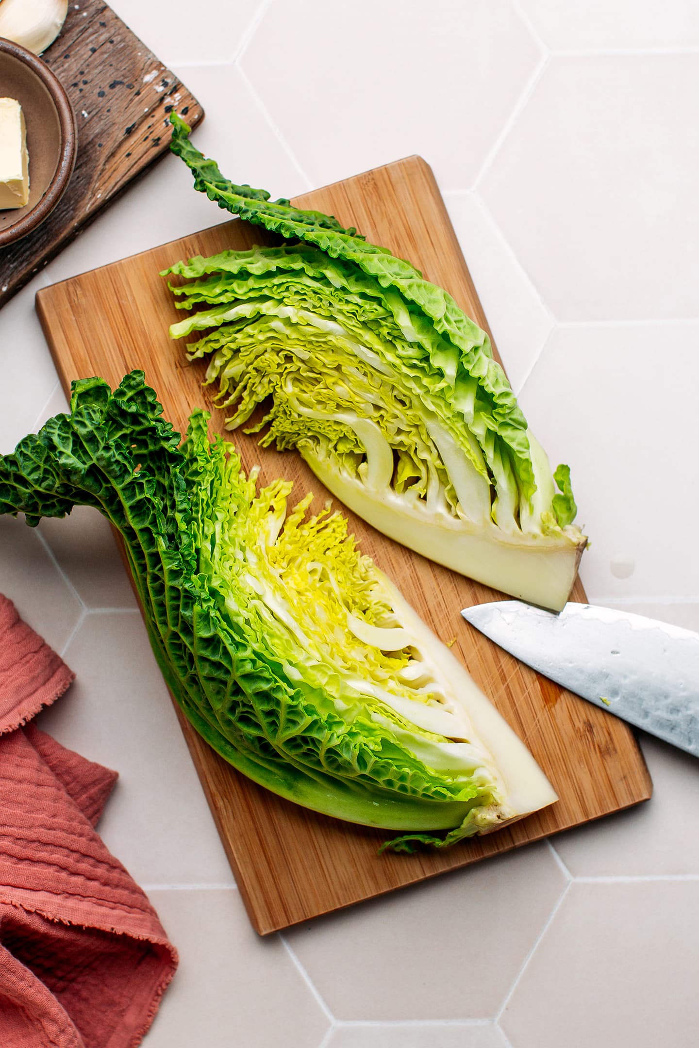 Sliced savoy cabbage on a cutting board.