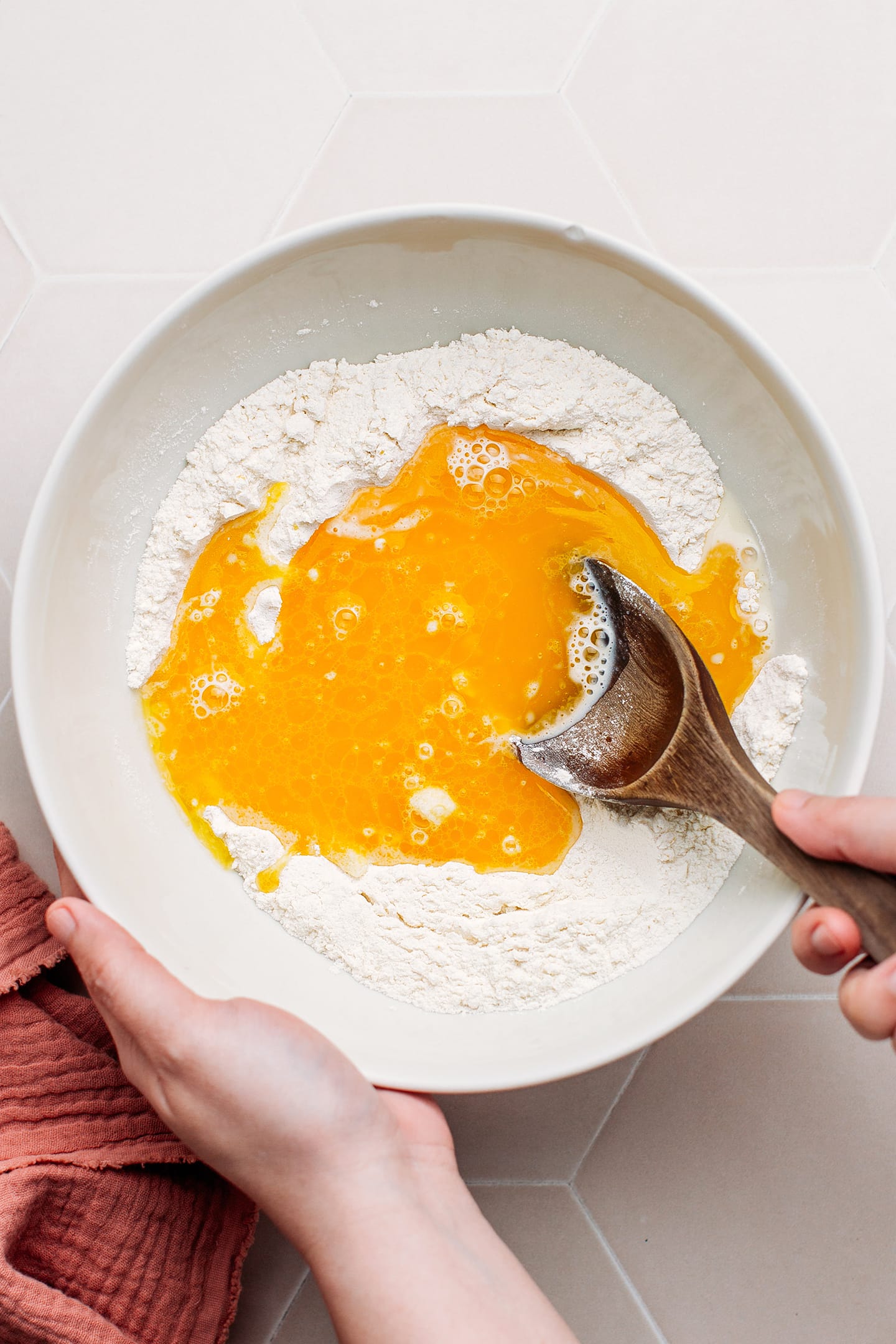 Flour, sugar, and melted butter in a bowl.