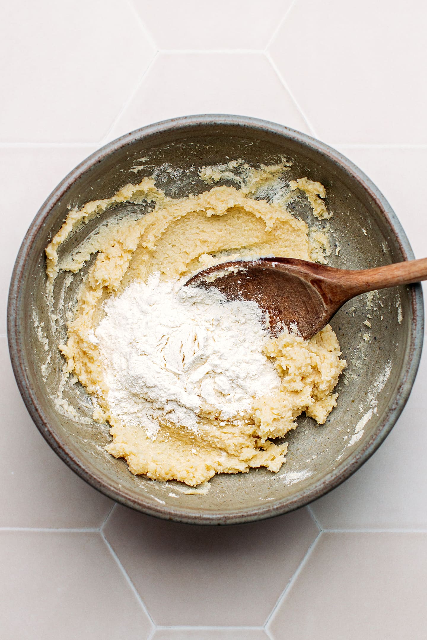 Cookie dough and flour in a mixing bowl.