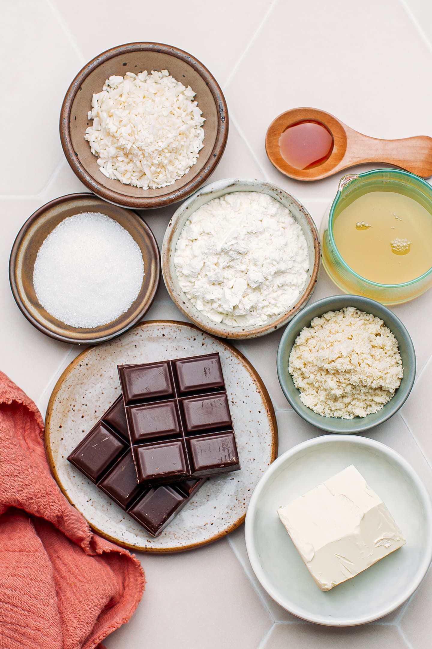 Ingredients like dark chocolate, flour, butter, almond flour, and sugar.