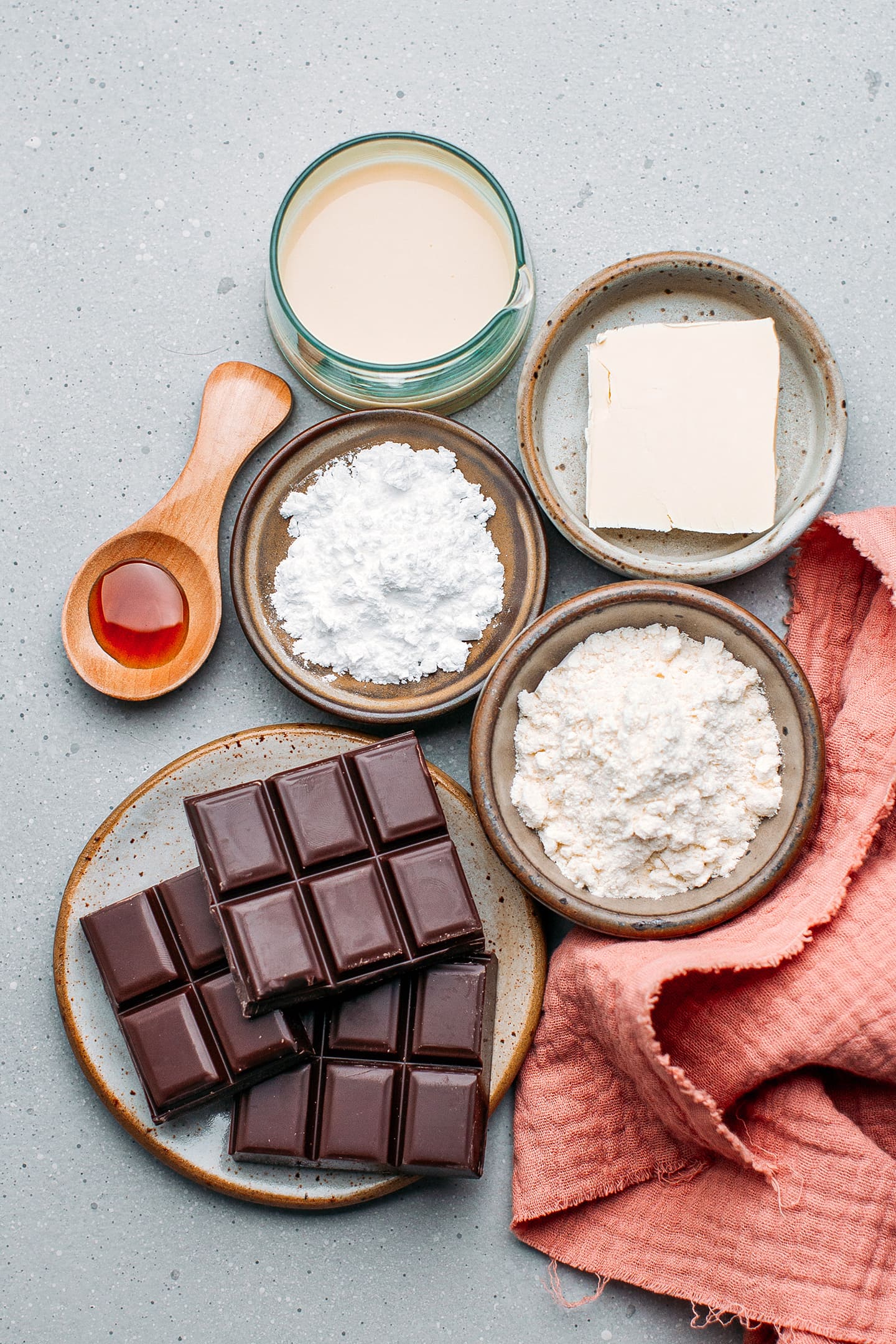 Ingredients like dark chocolate, flour, powdered sugar, and butter.