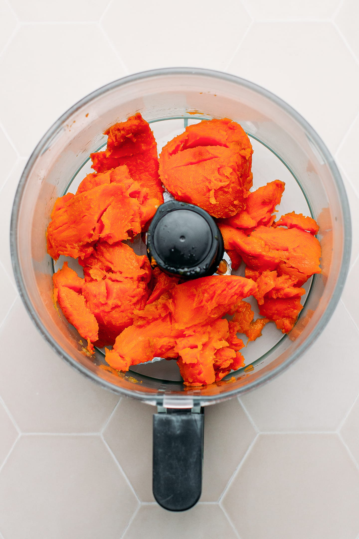 Baked sweet potatoes in a food processor.