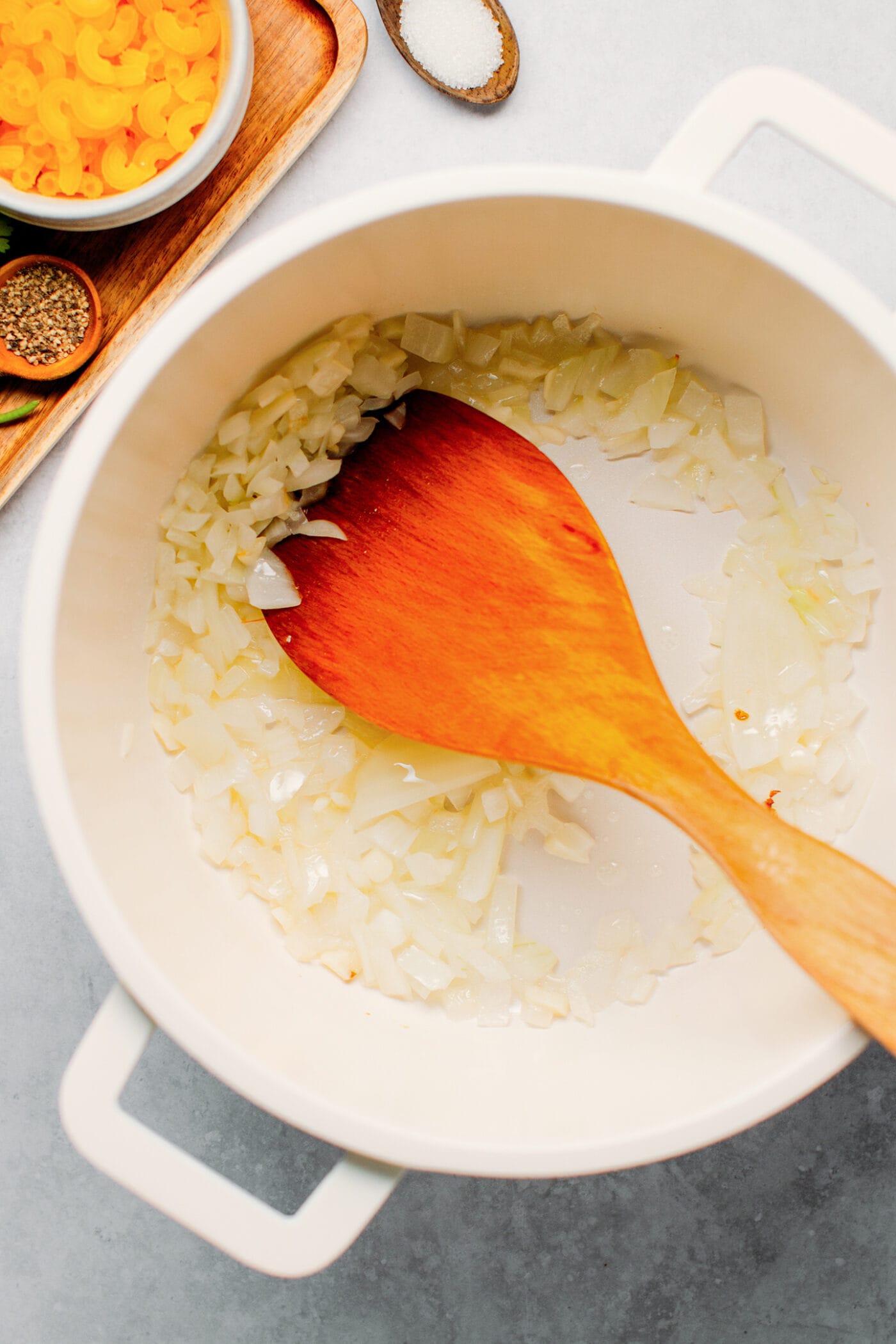 Cooking onions in a pot.