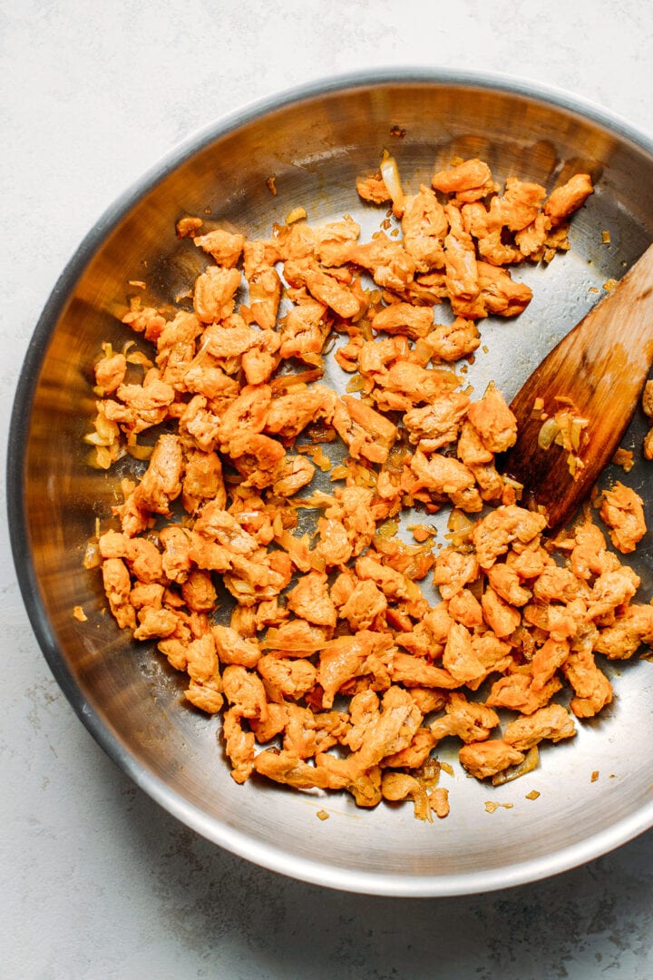 Cooking soy curls with garlic and shallots.