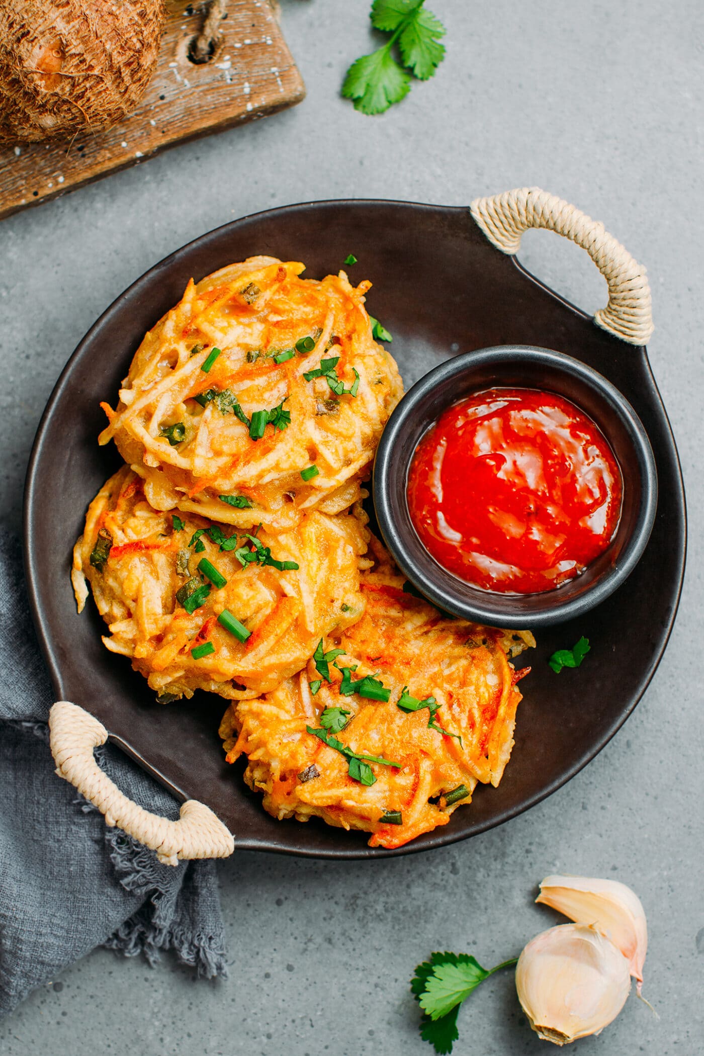 Taro fritters with green onions and a sweet chili sauce.