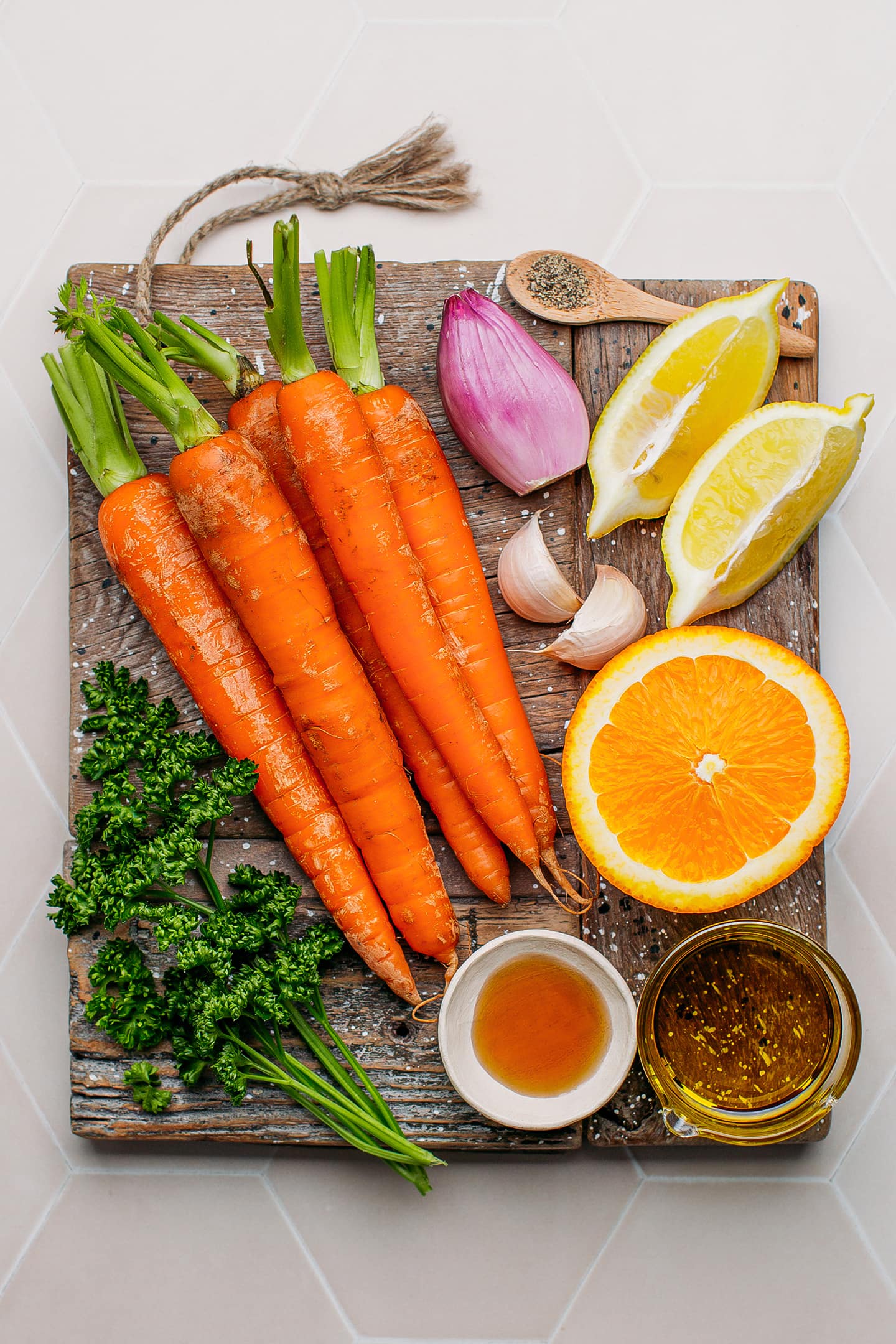 Ingredients like carrots, lemon, shallots, garlic, and parsley.