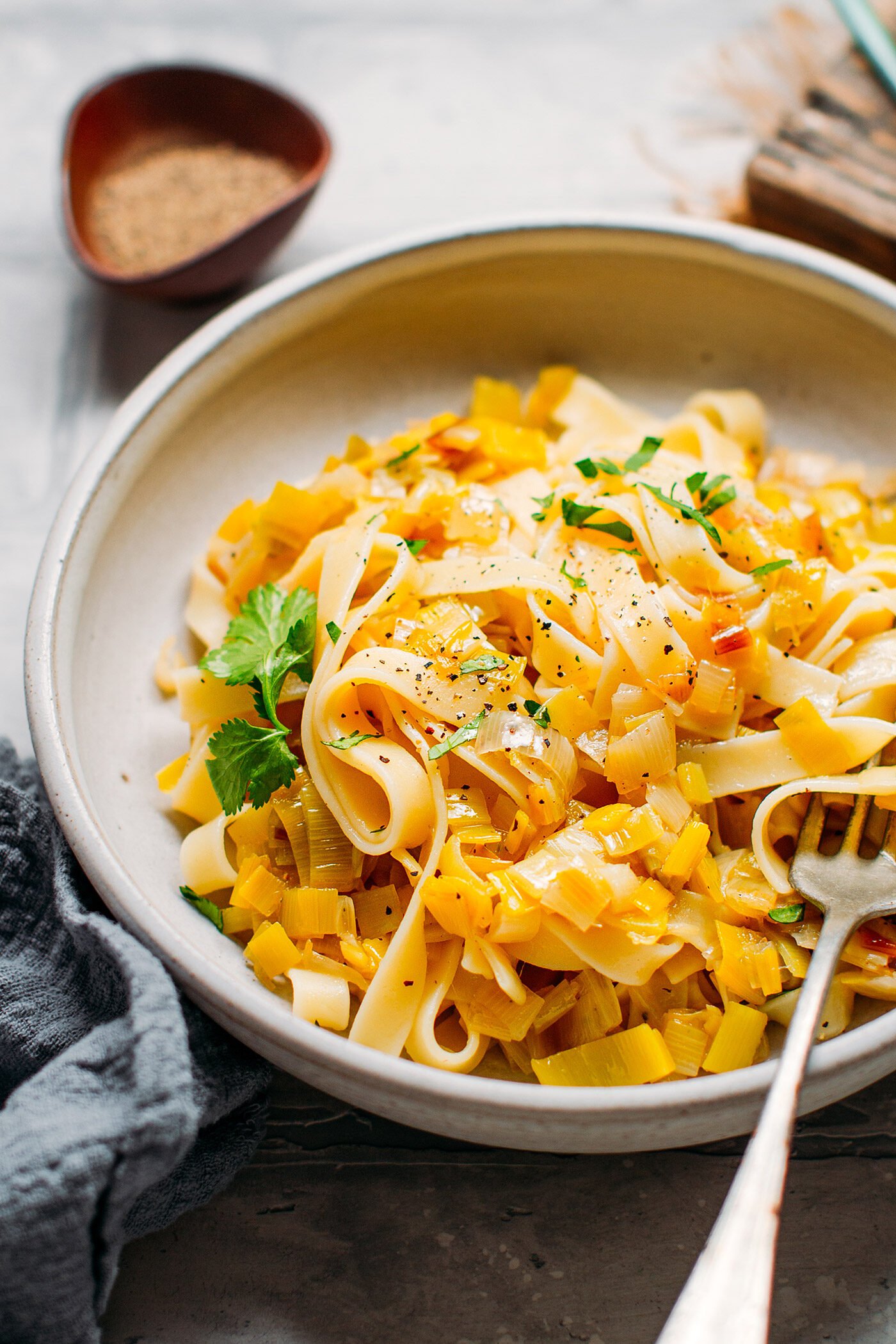 Pasta with melted leeks in a bowl