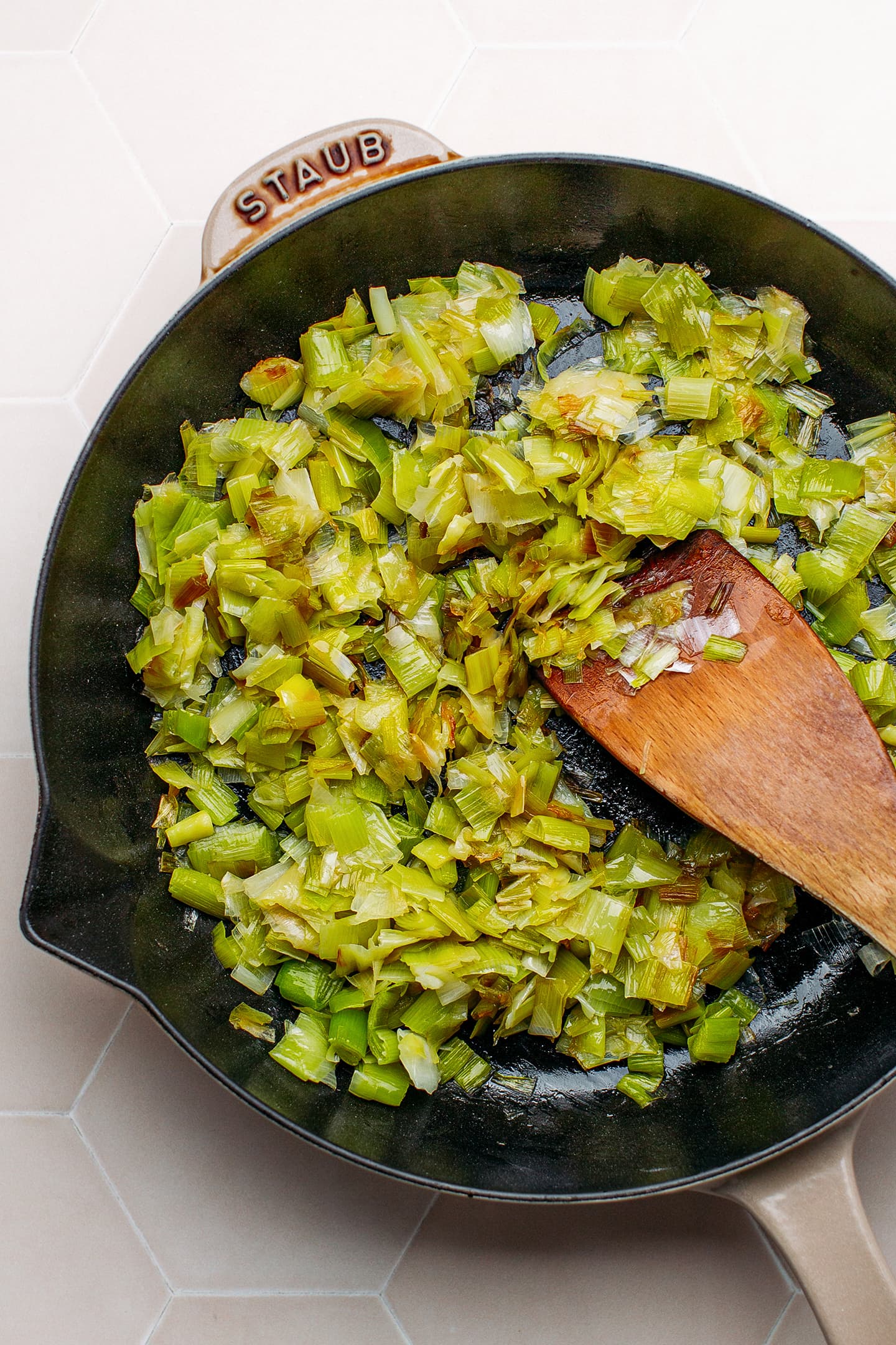 Sautéed leeks in a pan.