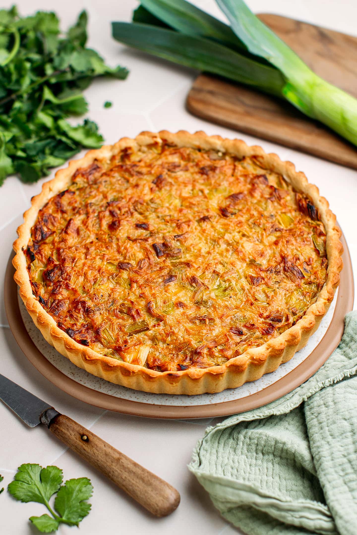 Leek tart on a serving plate.