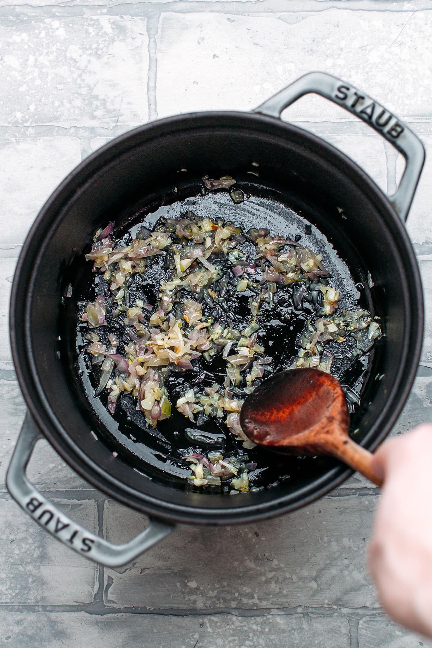Sautéed garlic and shallots in a pot.