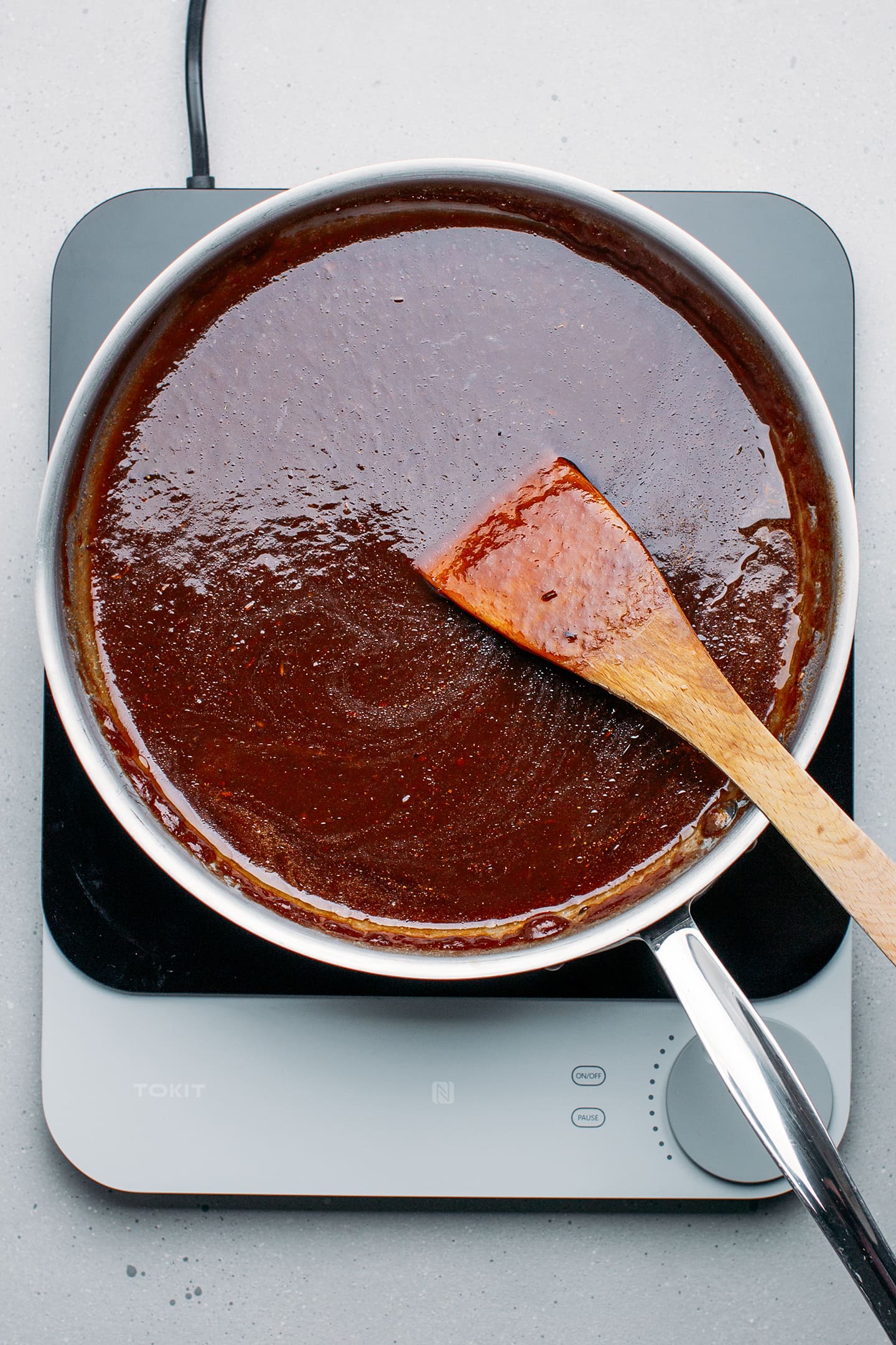 Tamarind sauce in a skillet.