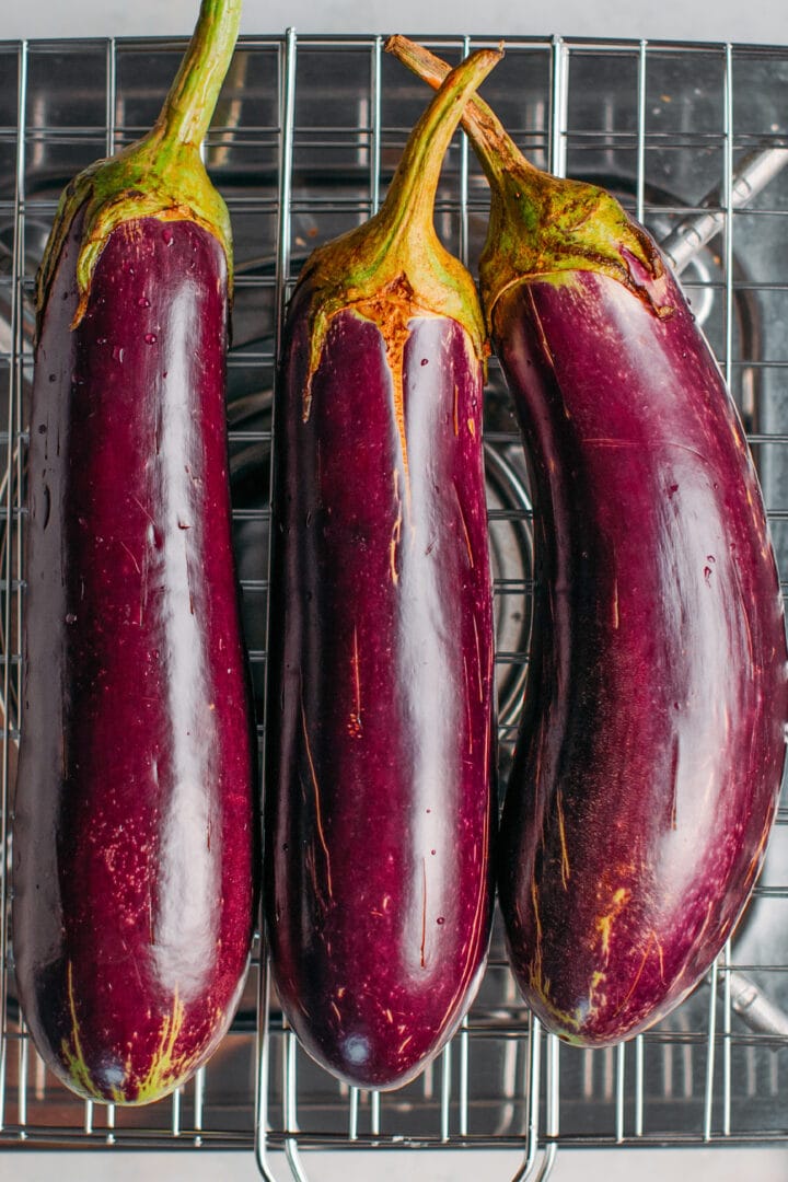 Chinese eggplants on a grilling basket.
