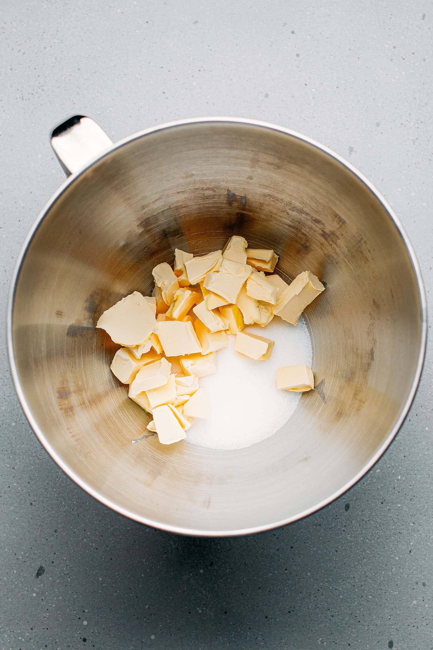 Butter and sugar in a mixing bowl.