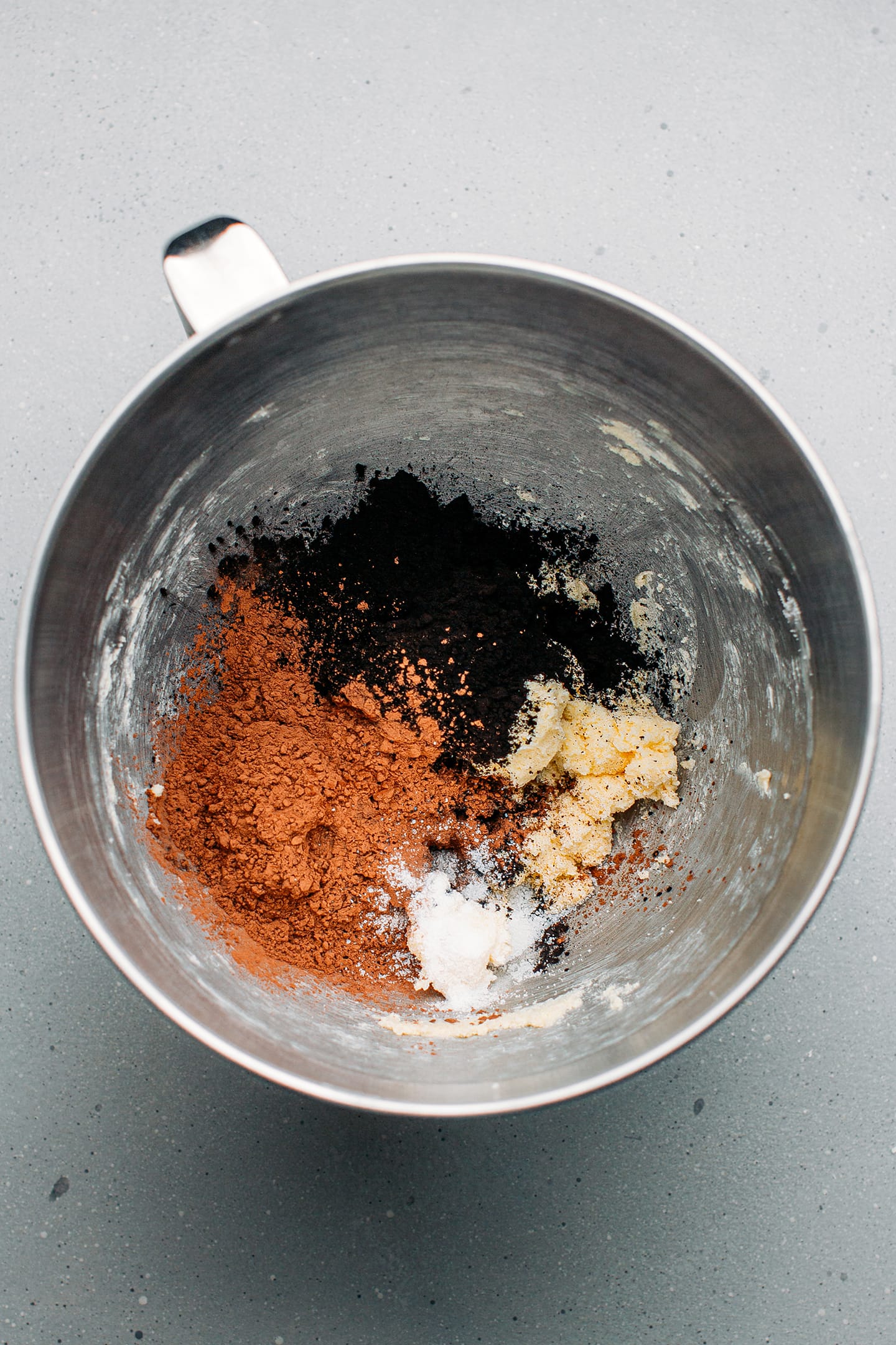 Creamed butter, cocoa powder, and salt in a mixing bowl.