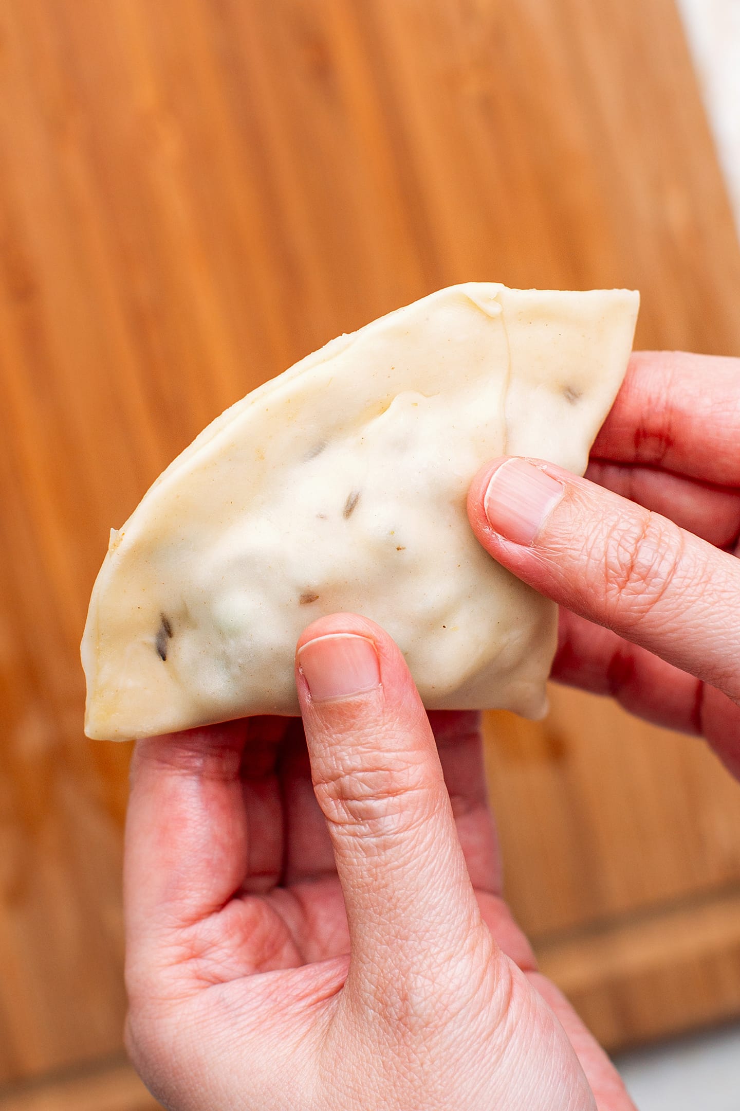 Sealing a samosa.