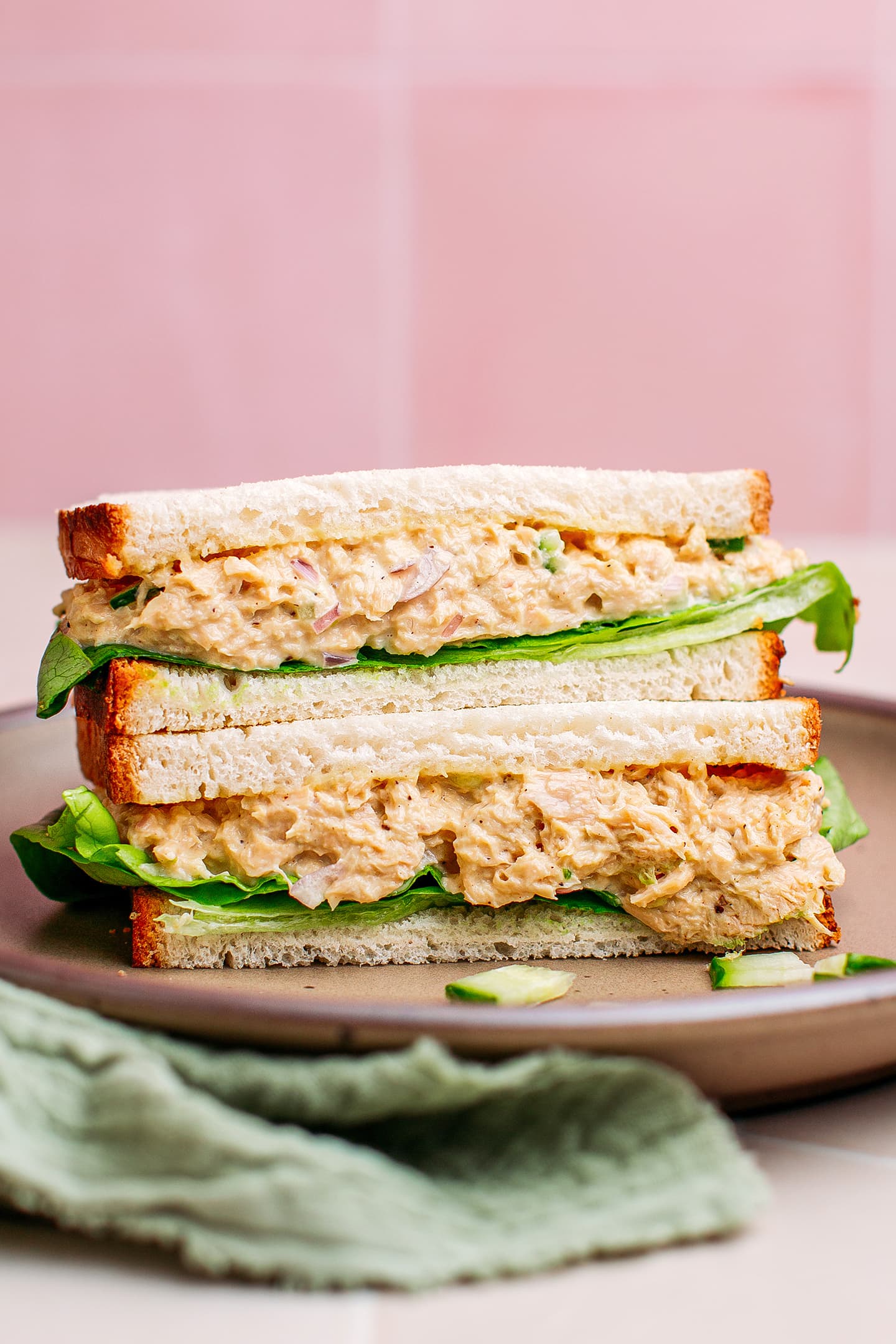 Vegan tuna sandwich with lettuce and cucumbers.