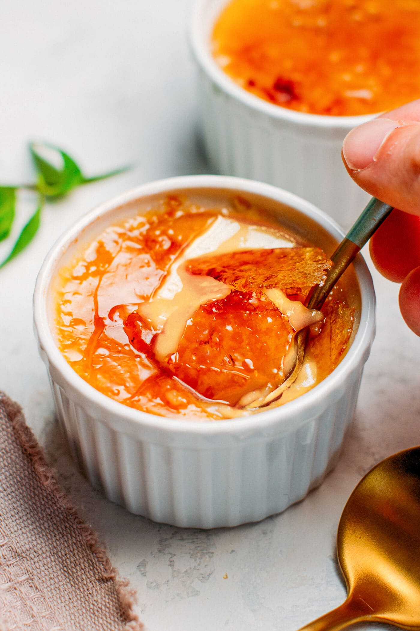 Digging into vegan creme brulée with crispy caramel.