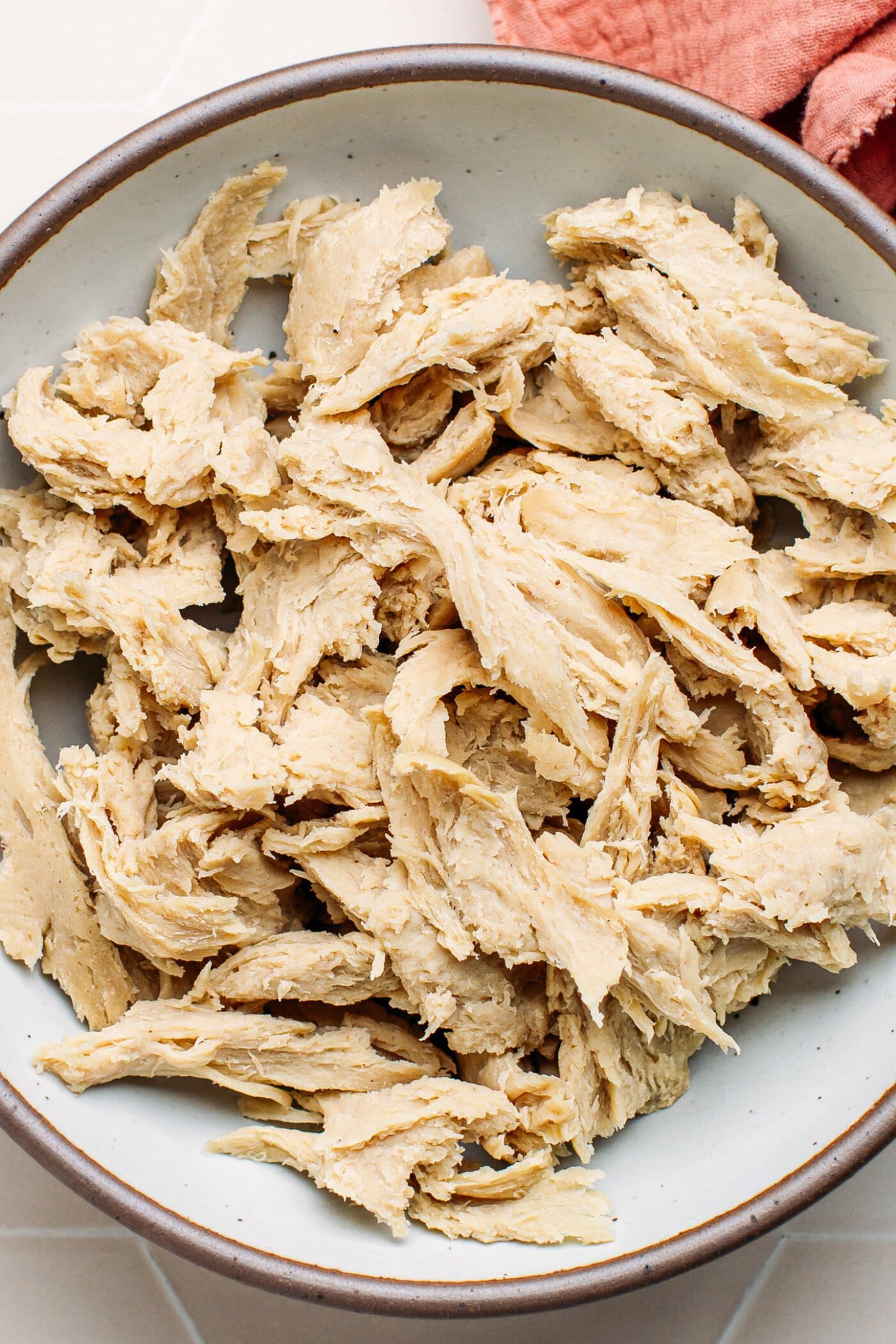 Shredded vegan chicken in a bowl.