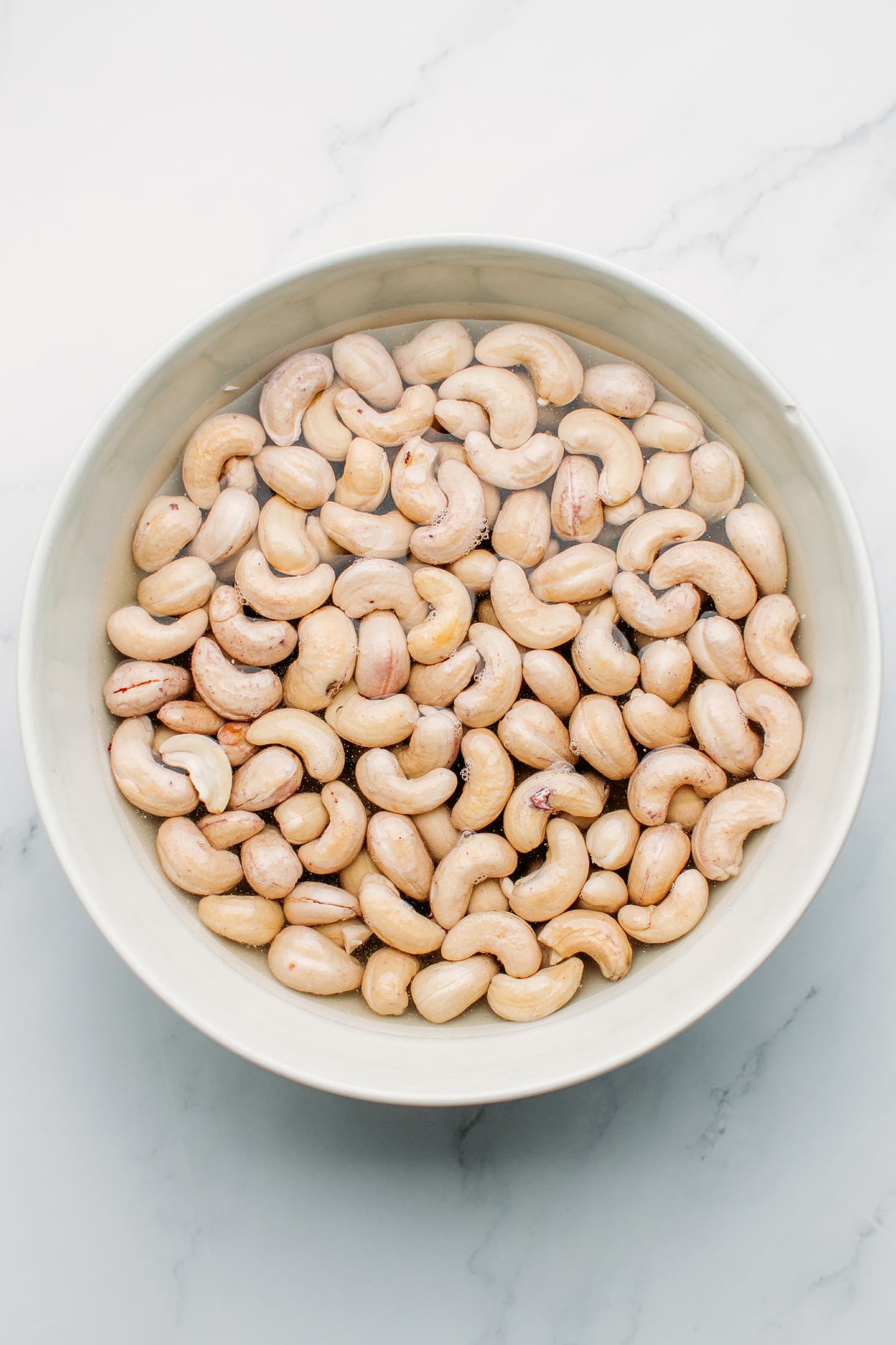 Soaked cashews in a bowl.