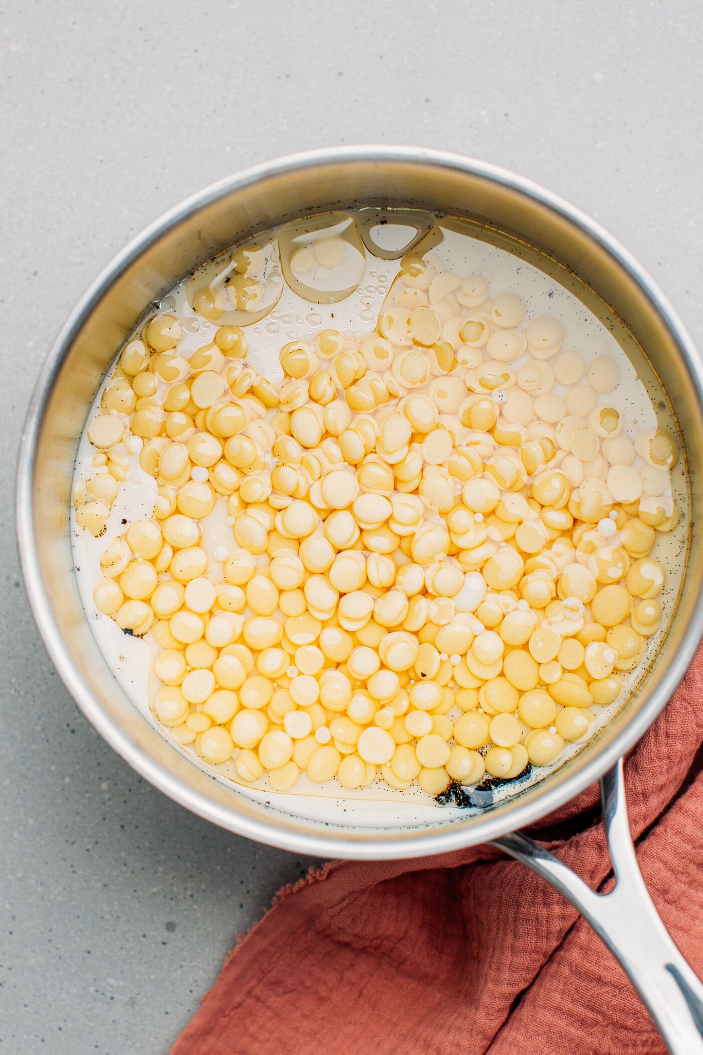 Cacao butter, milk, and vanilla in a saucepan.