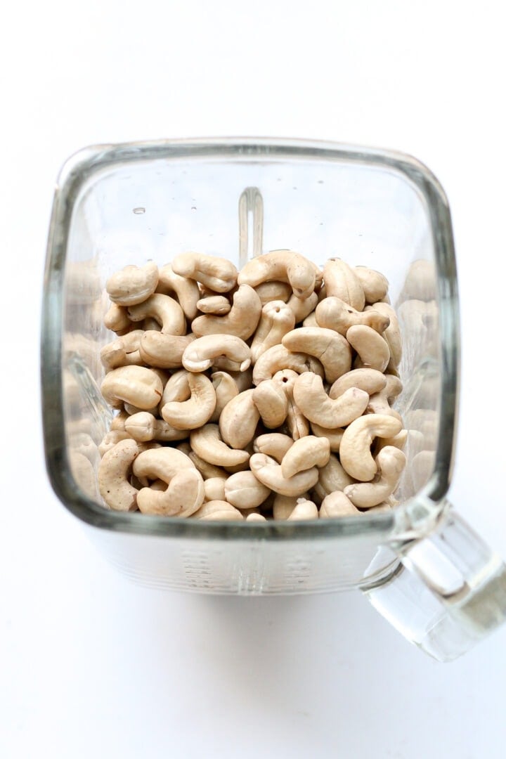 Raw cashews in a blender.