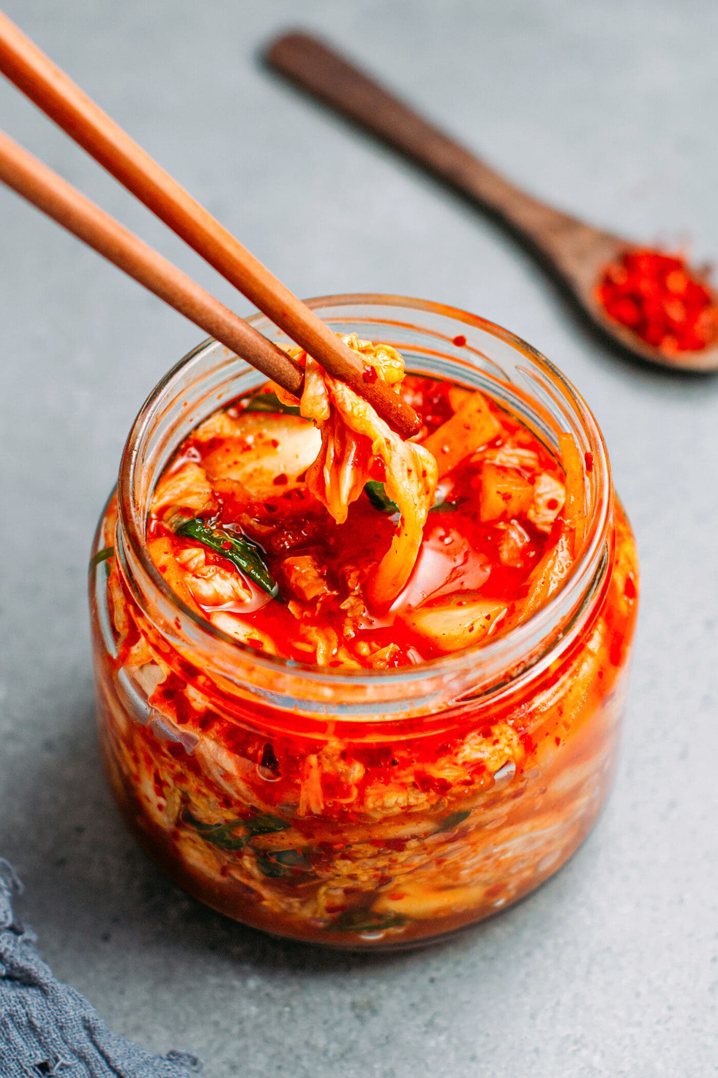 Picking vegan kimchi with chopsticks.