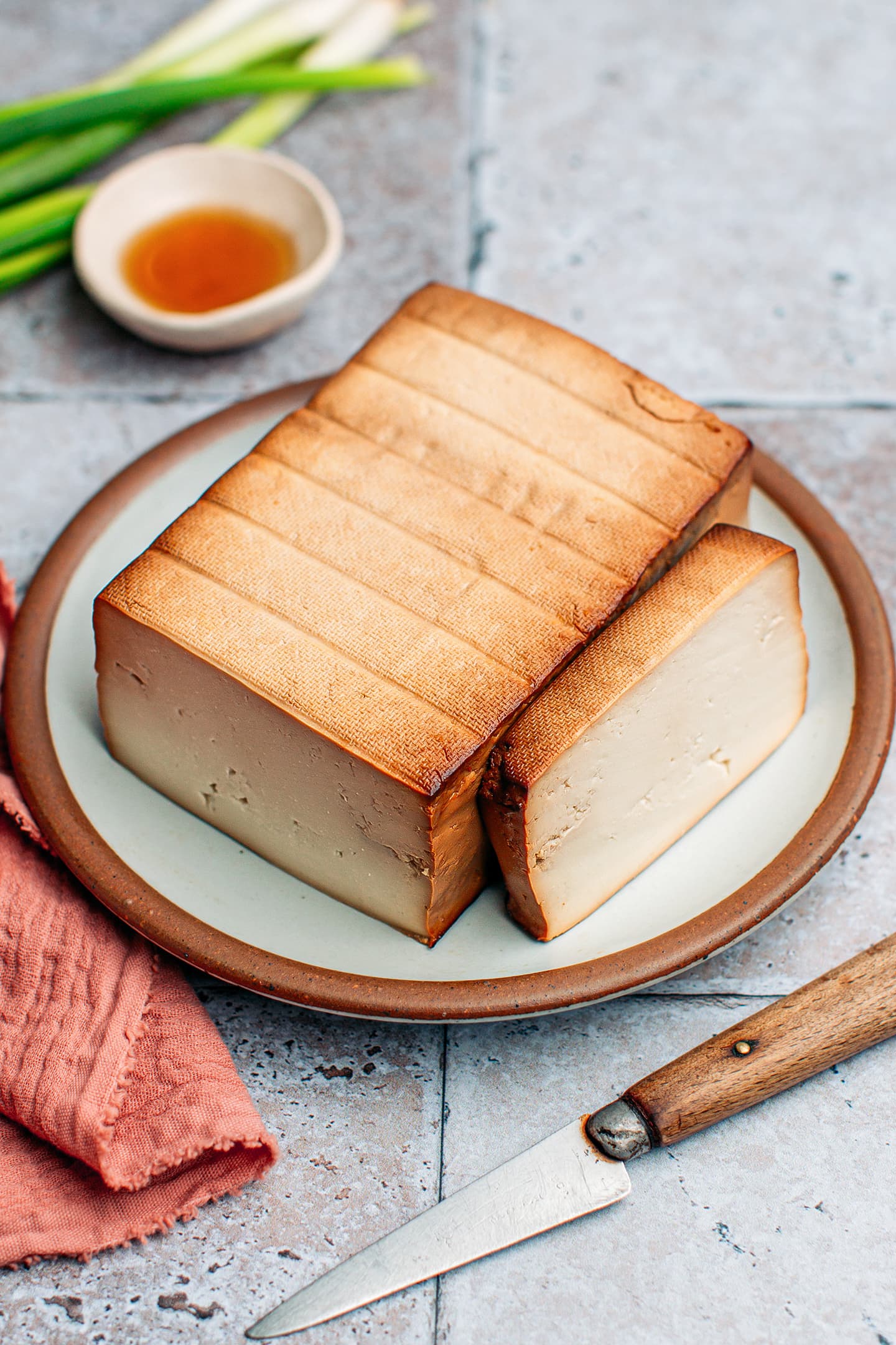 Block of smoked tofu on a plate.