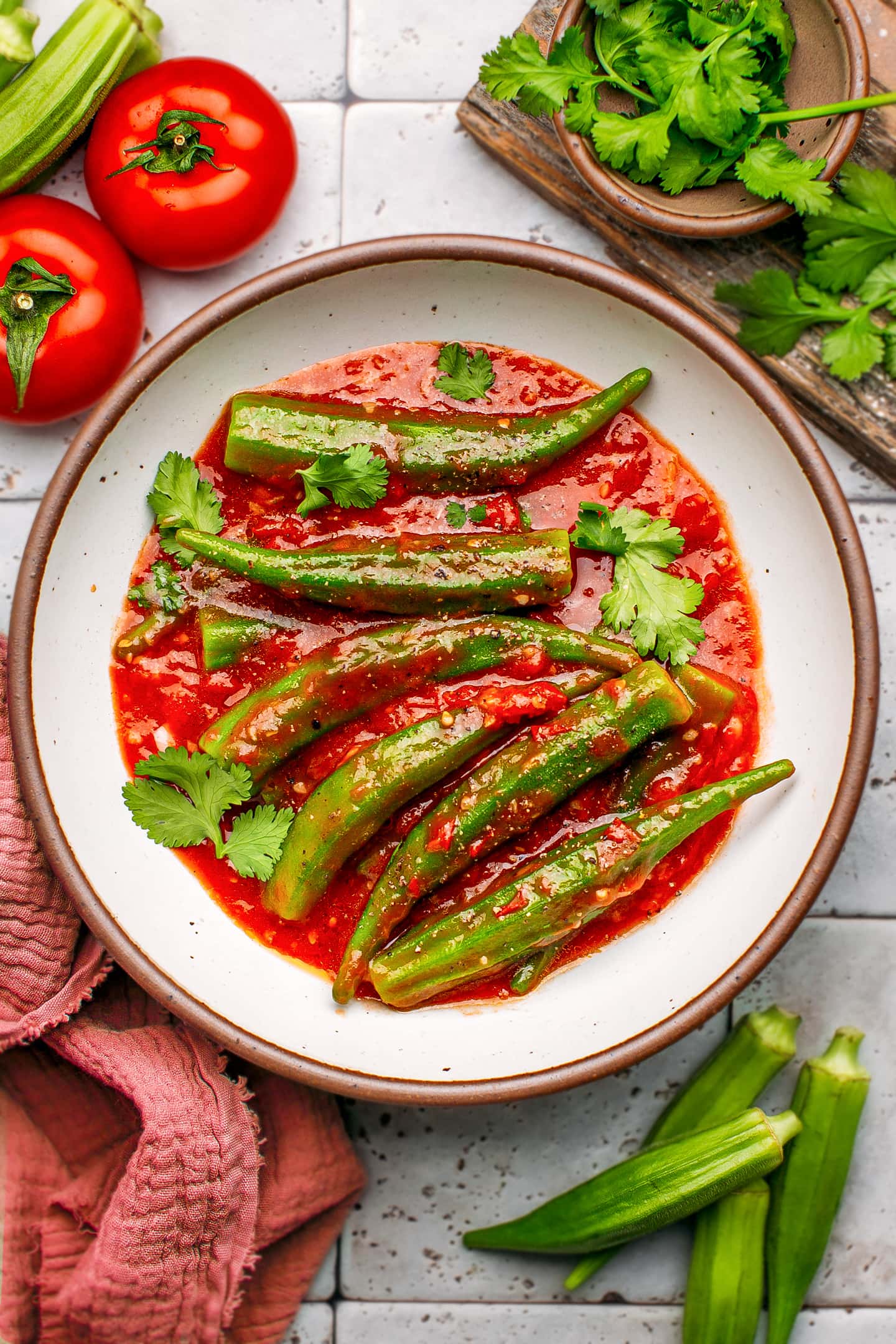 Okra pods in tomato sauce in a plate.