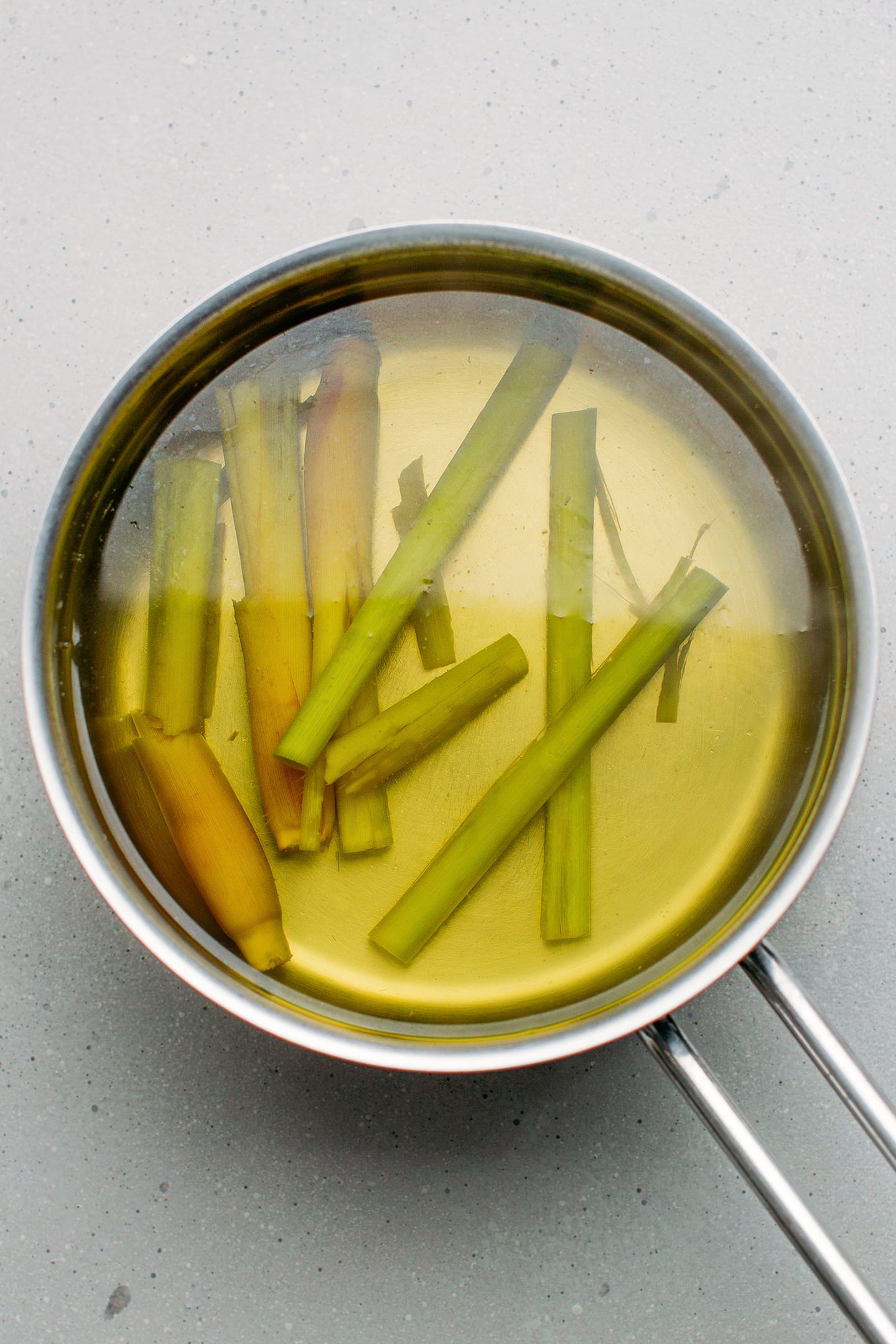 Lemongrass stalks in a saucepan.