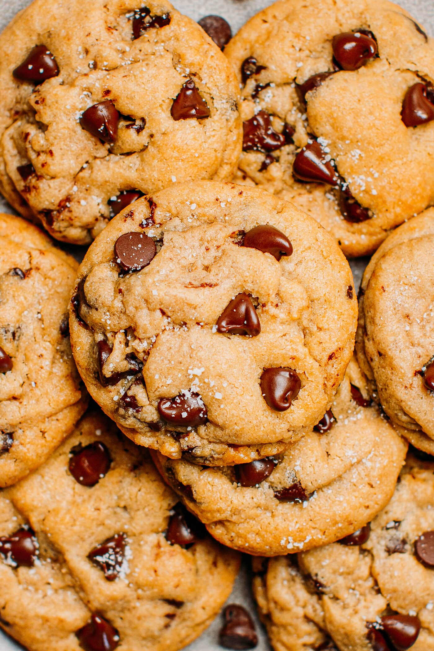 Chocolate chip cookies with sea salt on a plate.