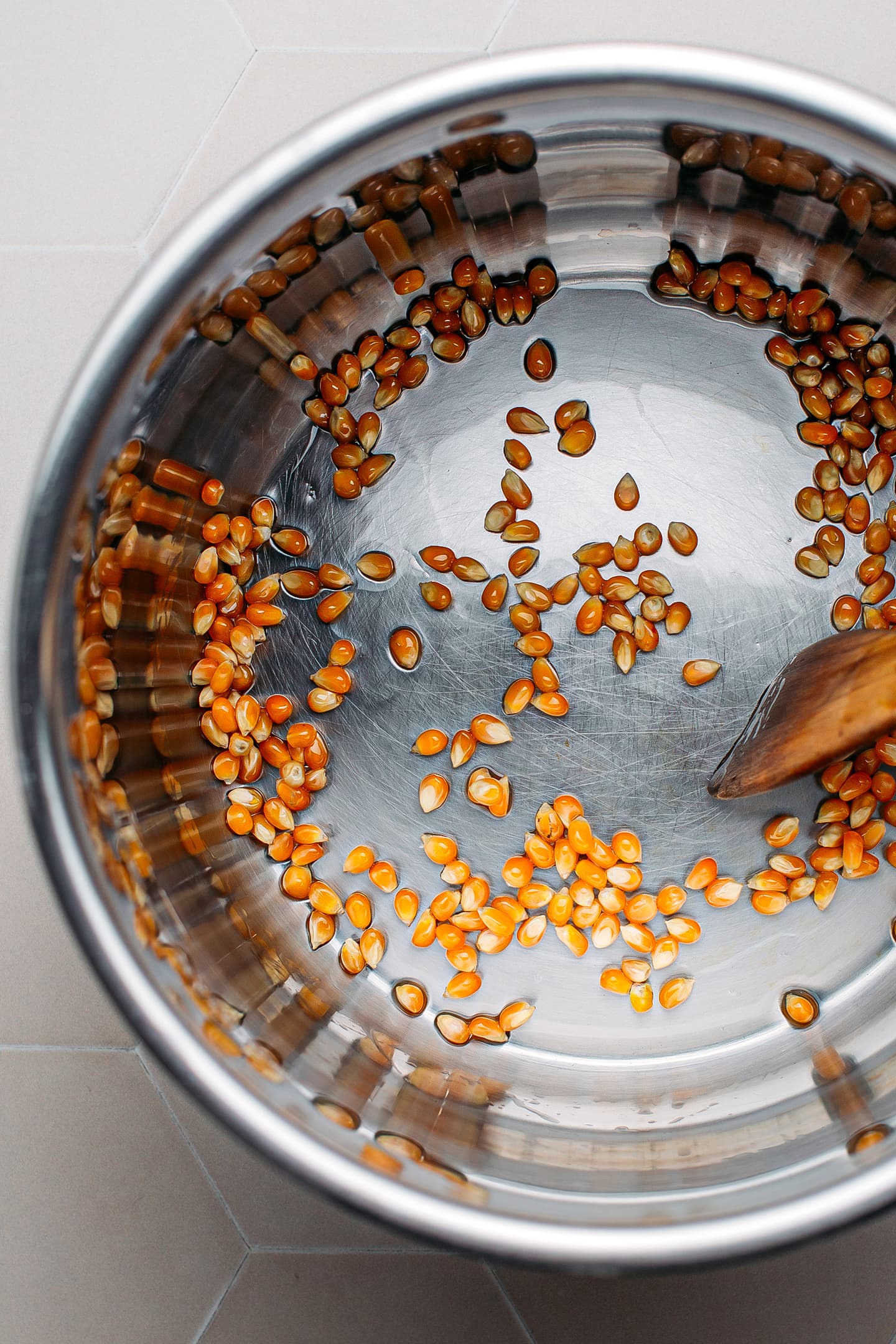 Popcorn kernels in a large pot.