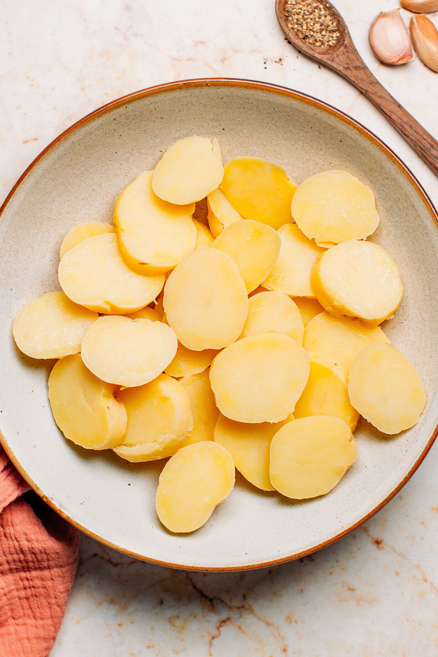 Cooked and sliced baby potatoes.
