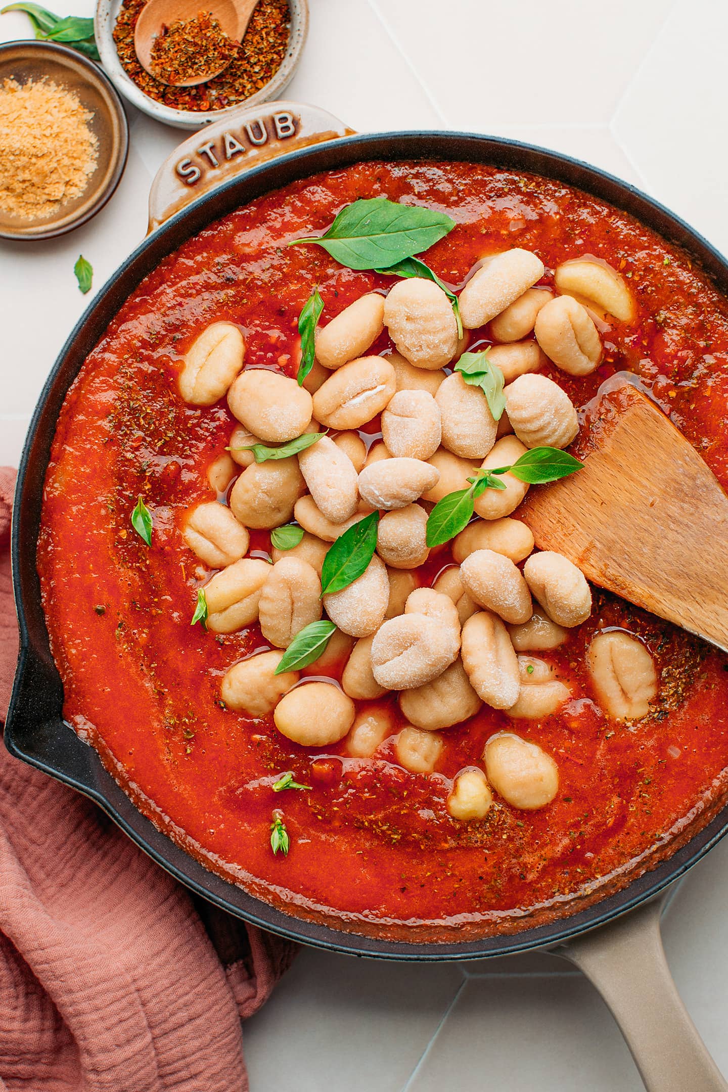 Gnocchi and tomato sauce in a skillet.
