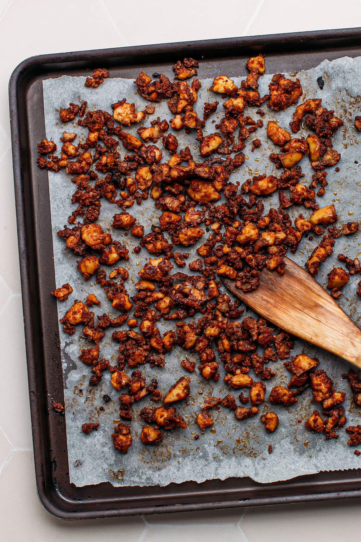 Baked scrambled tofu on a baking sheet.