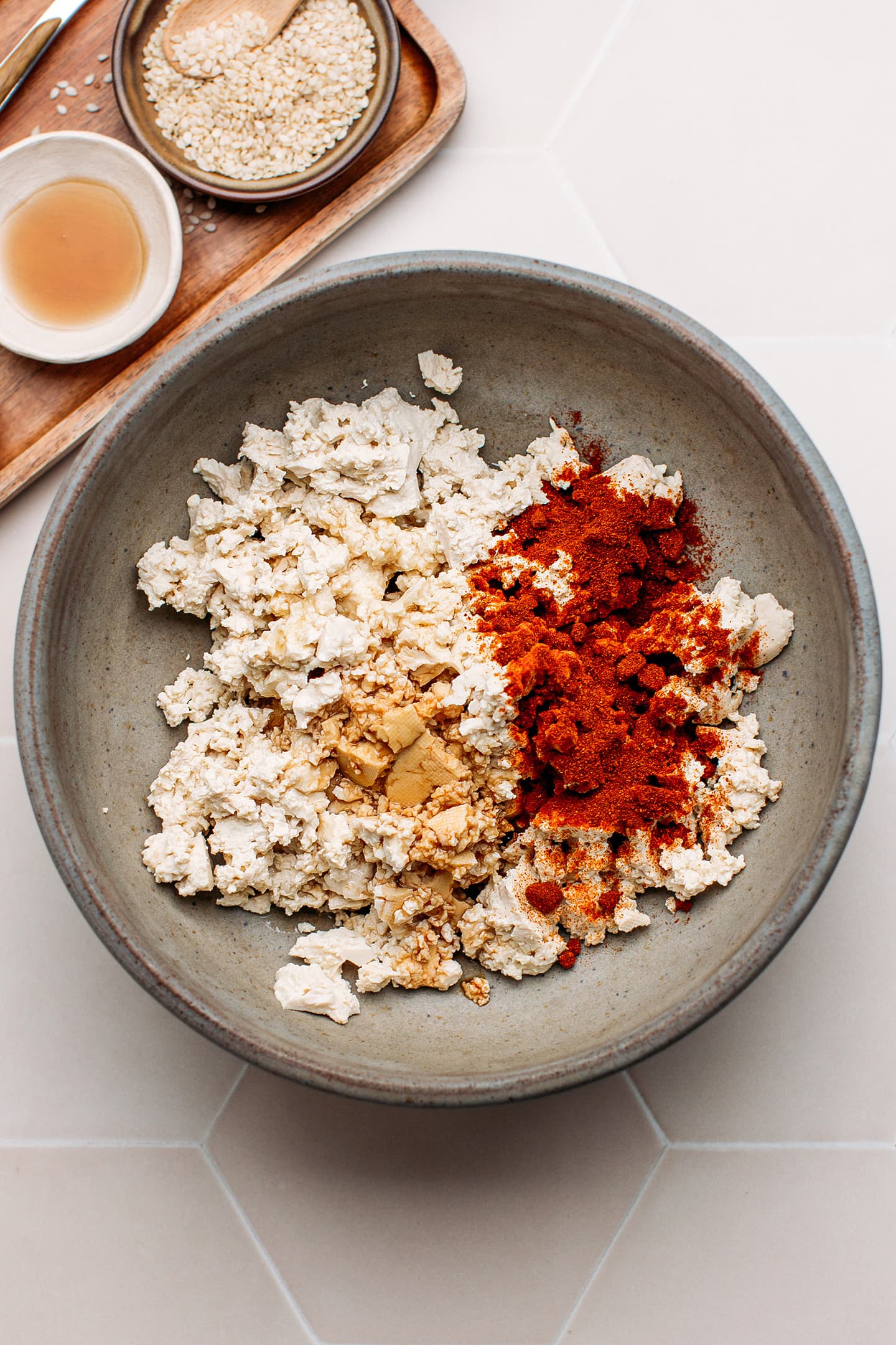 Scrambled tofu, smoked paprika, and soy sauce in a bowl.