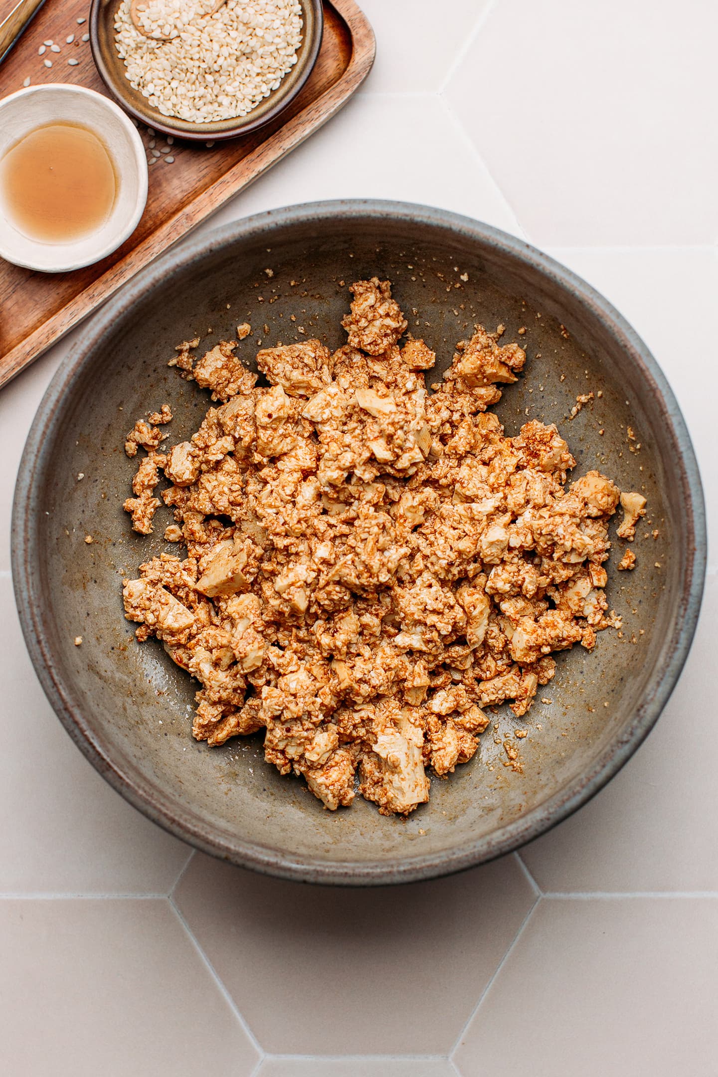 Scrambled tofu seasoned with smoked paprika and soy sauce in a bowl.