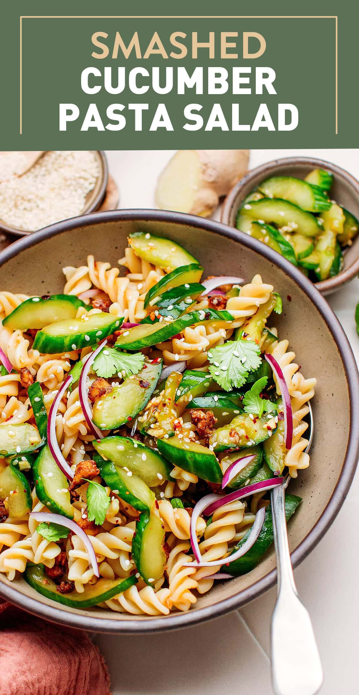 This smashed cucumber salad combines crispy cucumbers with tender fusilli pasta and meaty tofu crumbles. Seasoned with soy sauce, toasted sesame oil, and rice vinegar, this salad is refreshing, packed with texture, and superbly seasoned! #smashedcucumbers #vegansalad