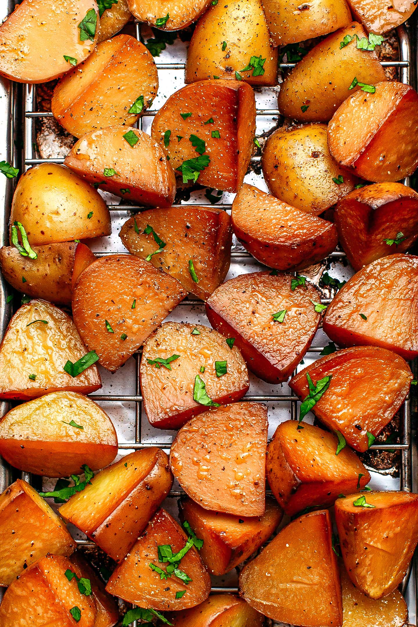 Quartered smoked potatoes in a stovetop smoker.