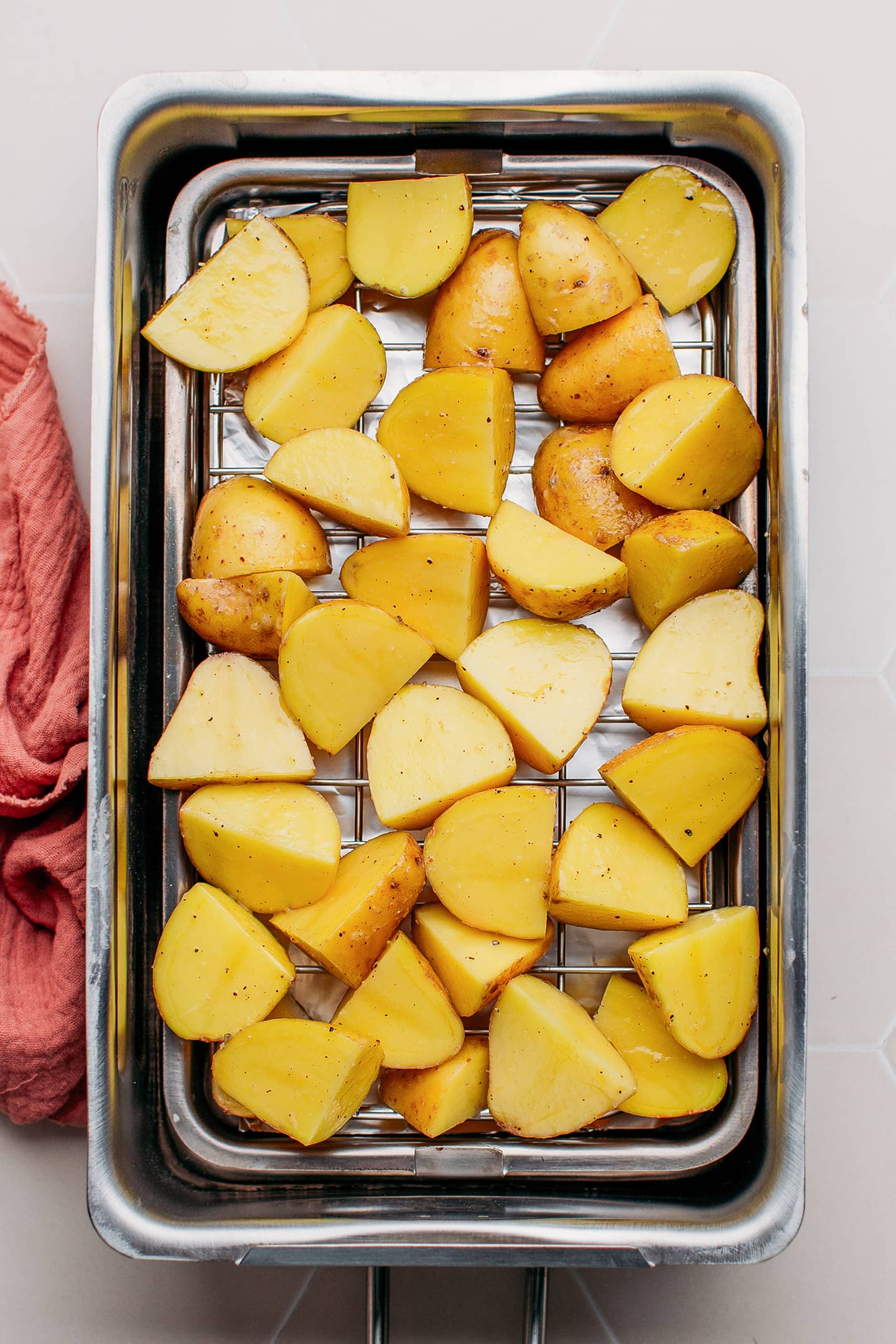 Quartered potatoes in a stovetop smoker.
