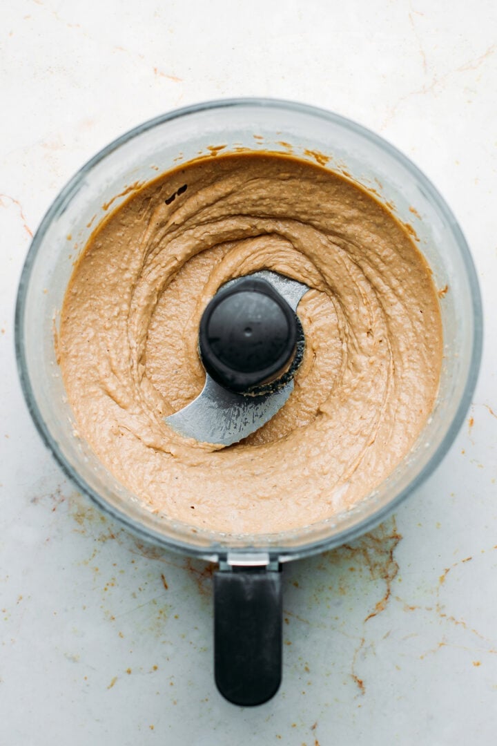 Caramelized shallots hummus in a food processor.