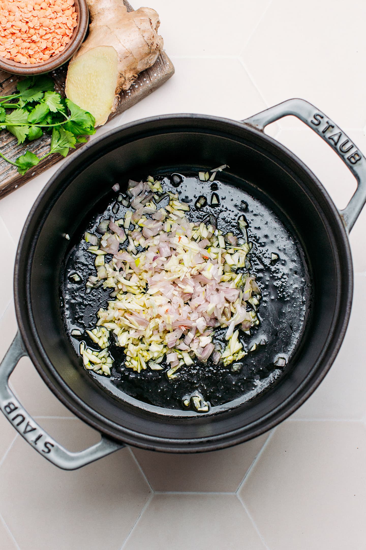 Shallots, garlic, and ginger in a pot.