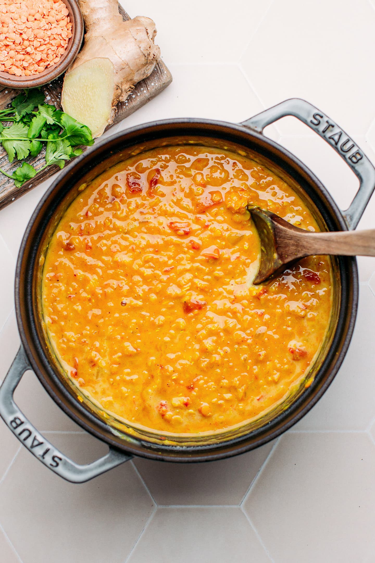 Cooked red lentil curry in a pot.