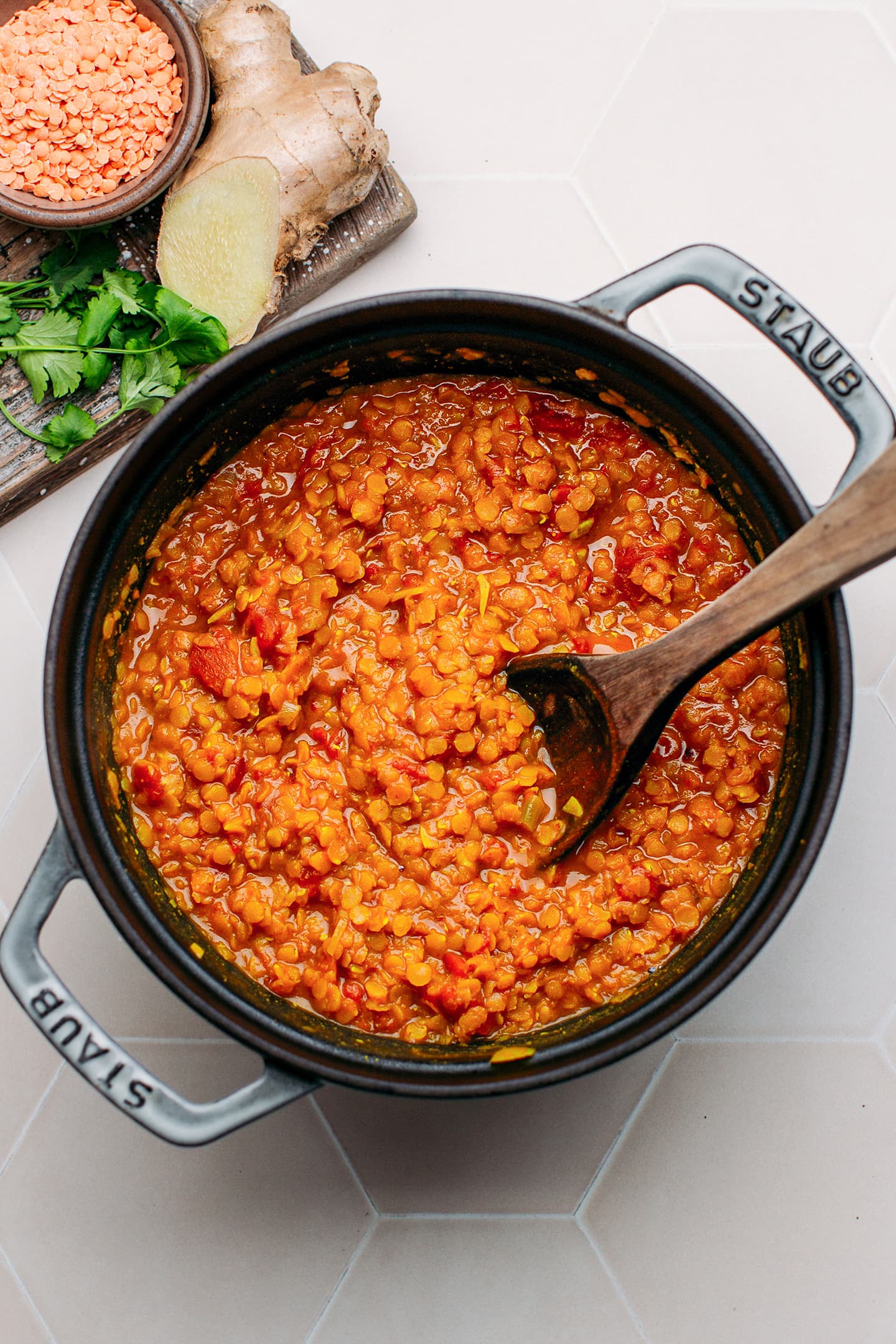 Cooked red lentils in a pot.