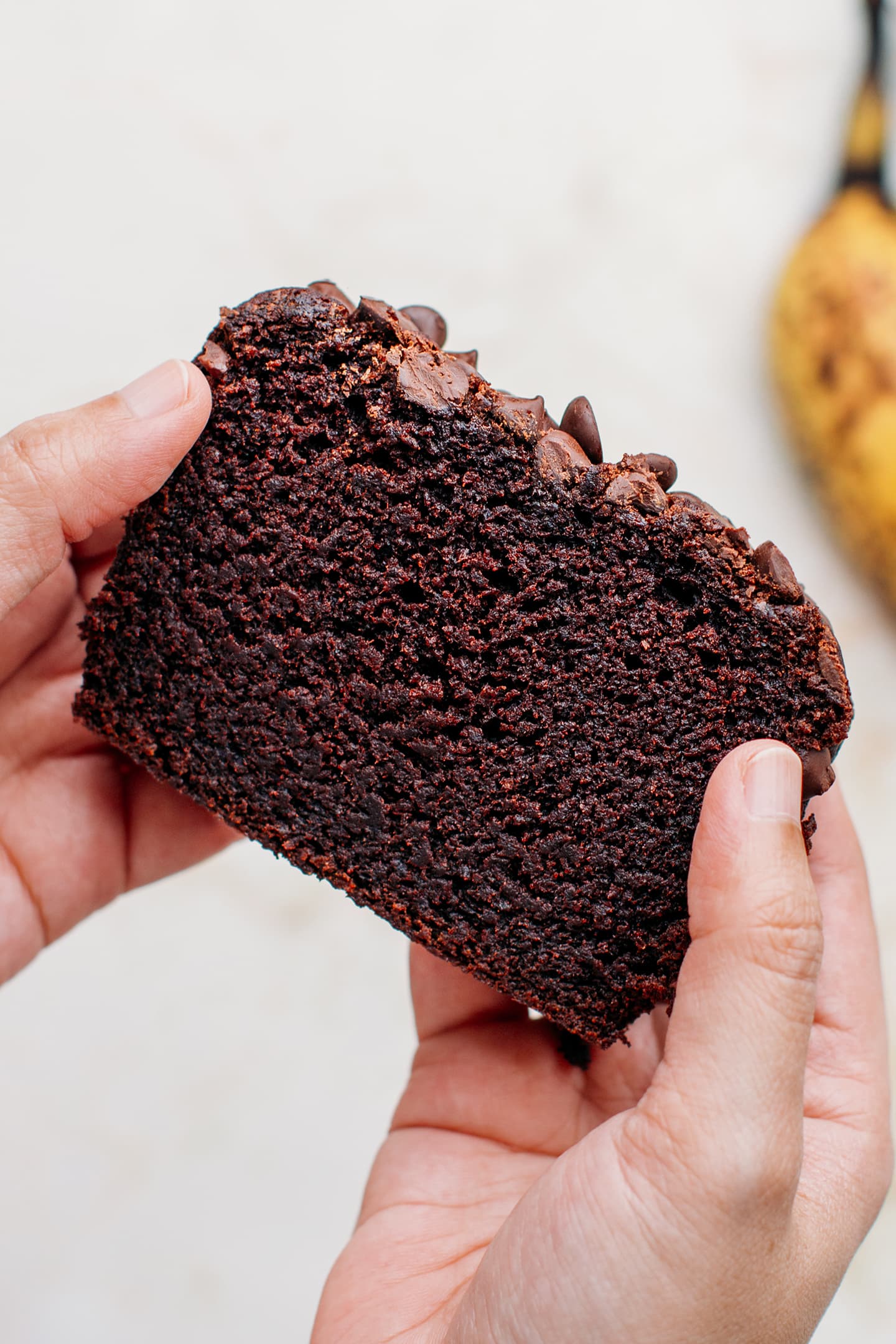 Close-up of a slice of vegan chocolate banana bread.