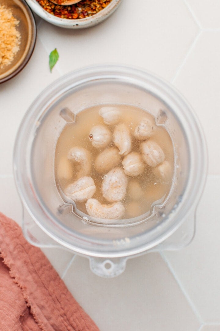 Raw cashews and water in a blender.